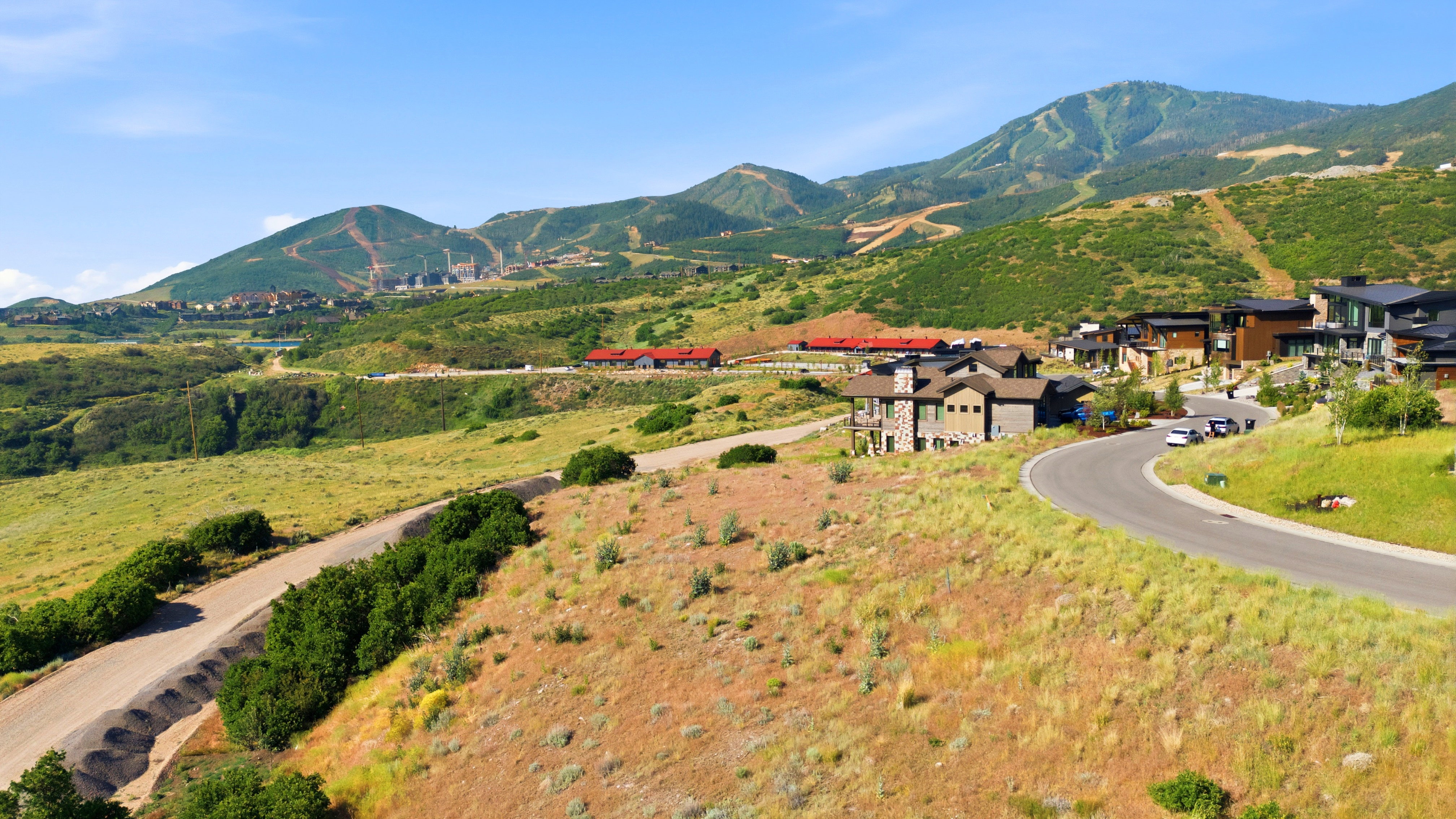 Expansive mountain landscape with scattered residential properties