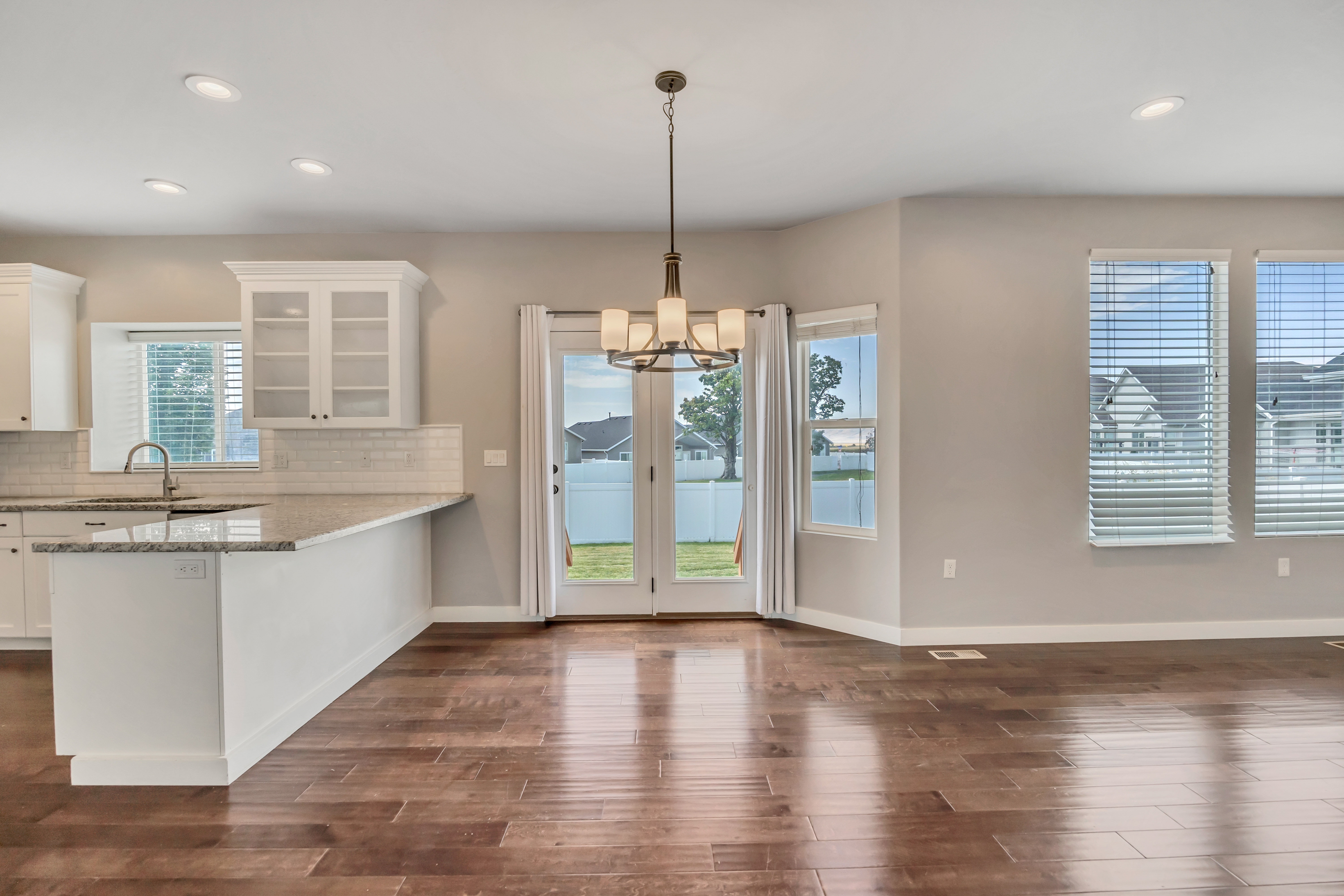 Open concept living area featuring wood-finish flooring