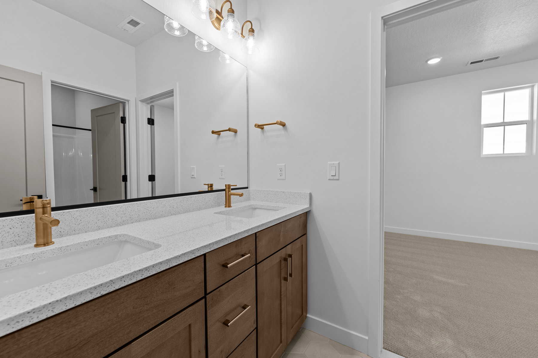 Jack and Jill Bathroom. Picture of another home with the same floorplan. Design selections may differ.
