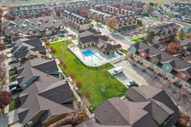 Aerial perspective of a residential community featuring townhomes with varied facade colors