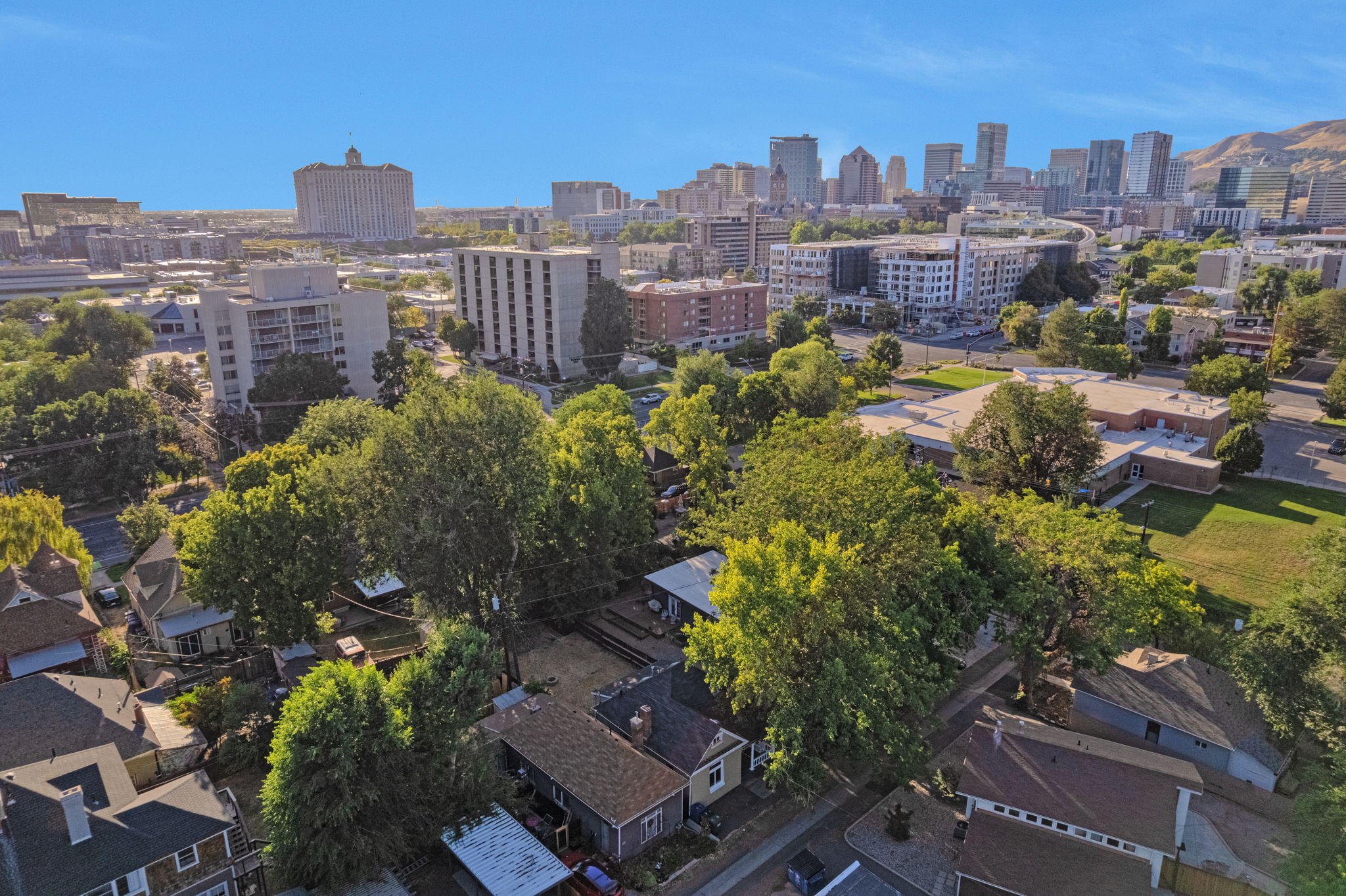 Aerial perspective showcasing urban surroundings with a prominent skyline