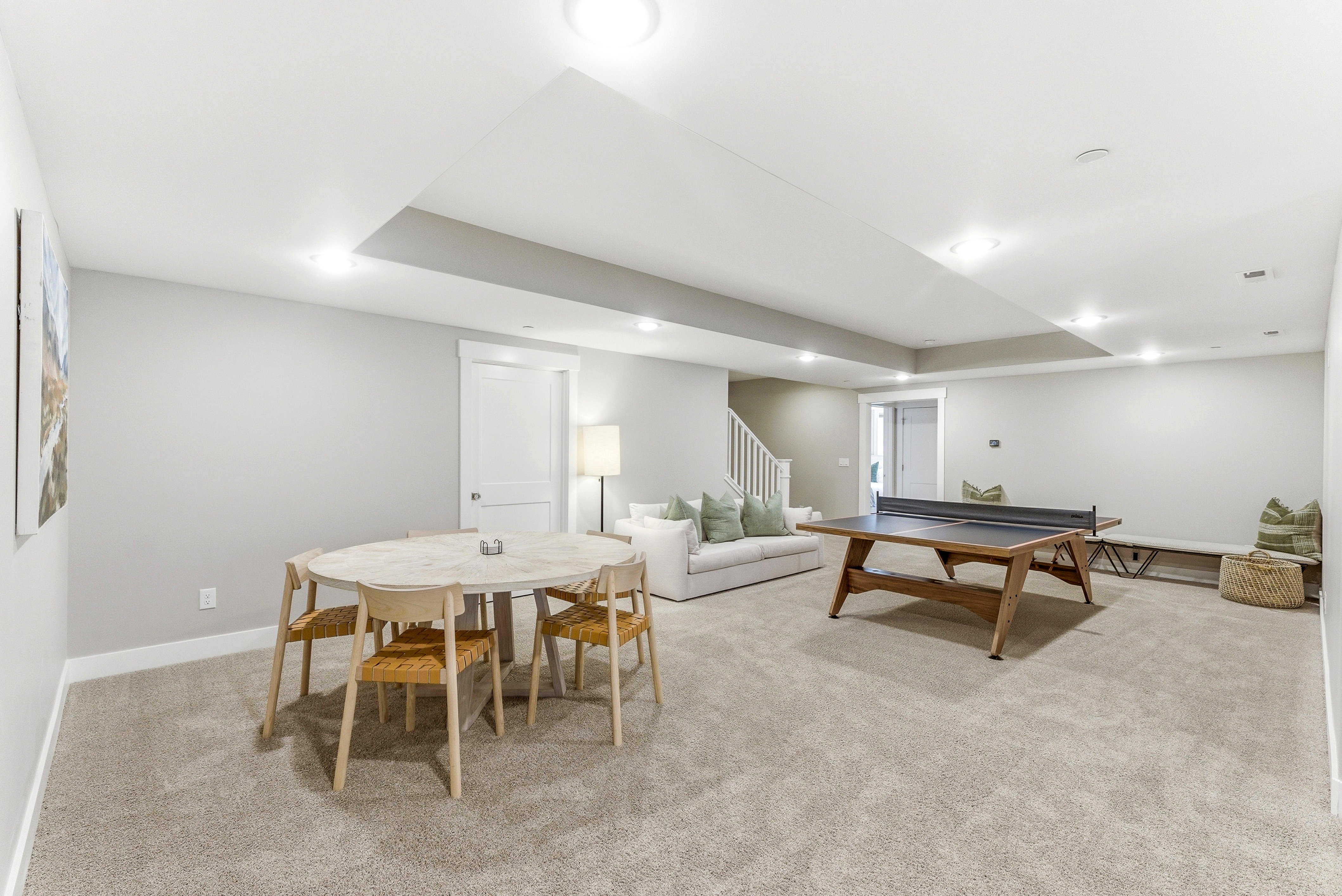Finished basement featuring recessed lighting and neutral-toned carpeting