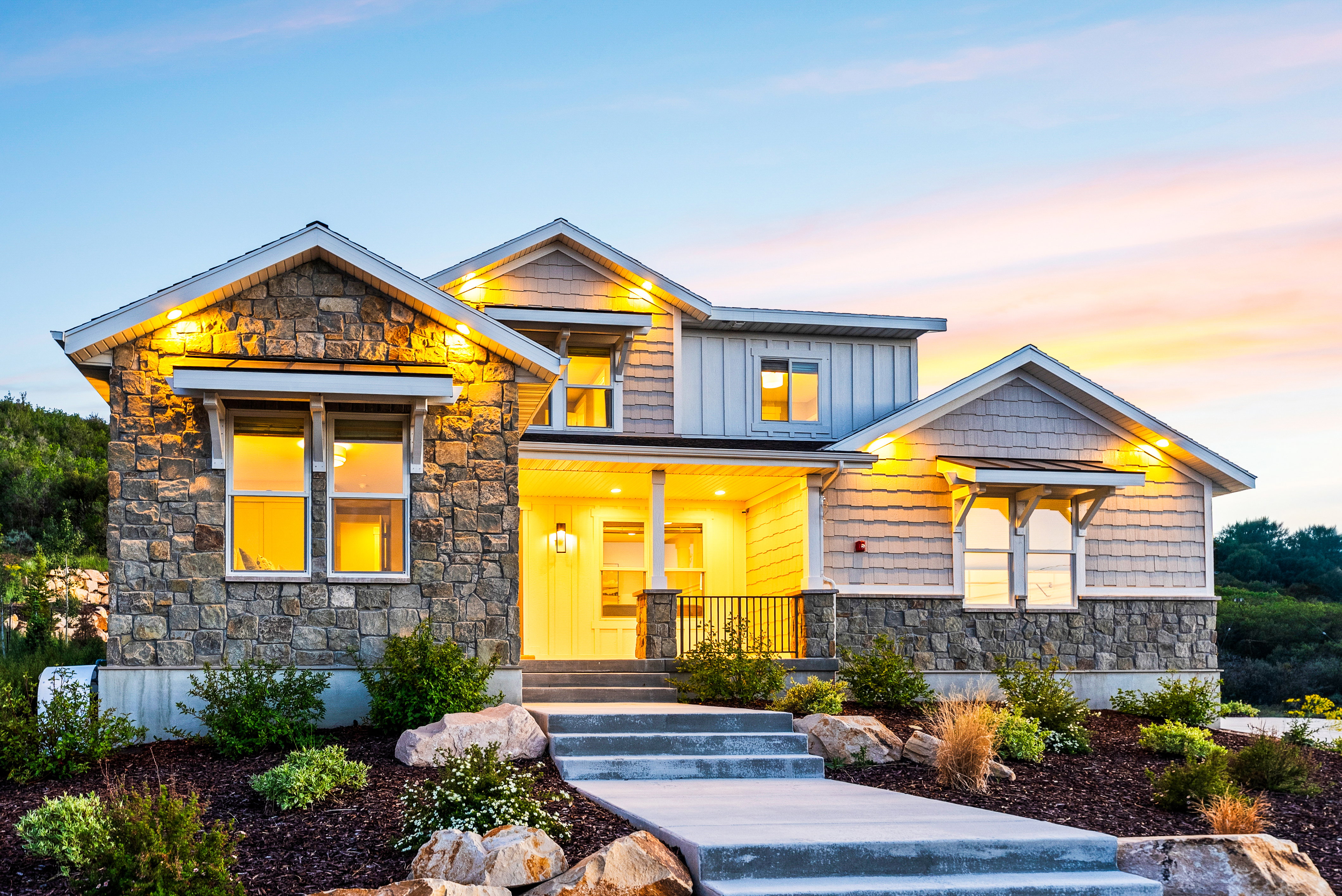 Stone and siding exterior with gabled roof lines