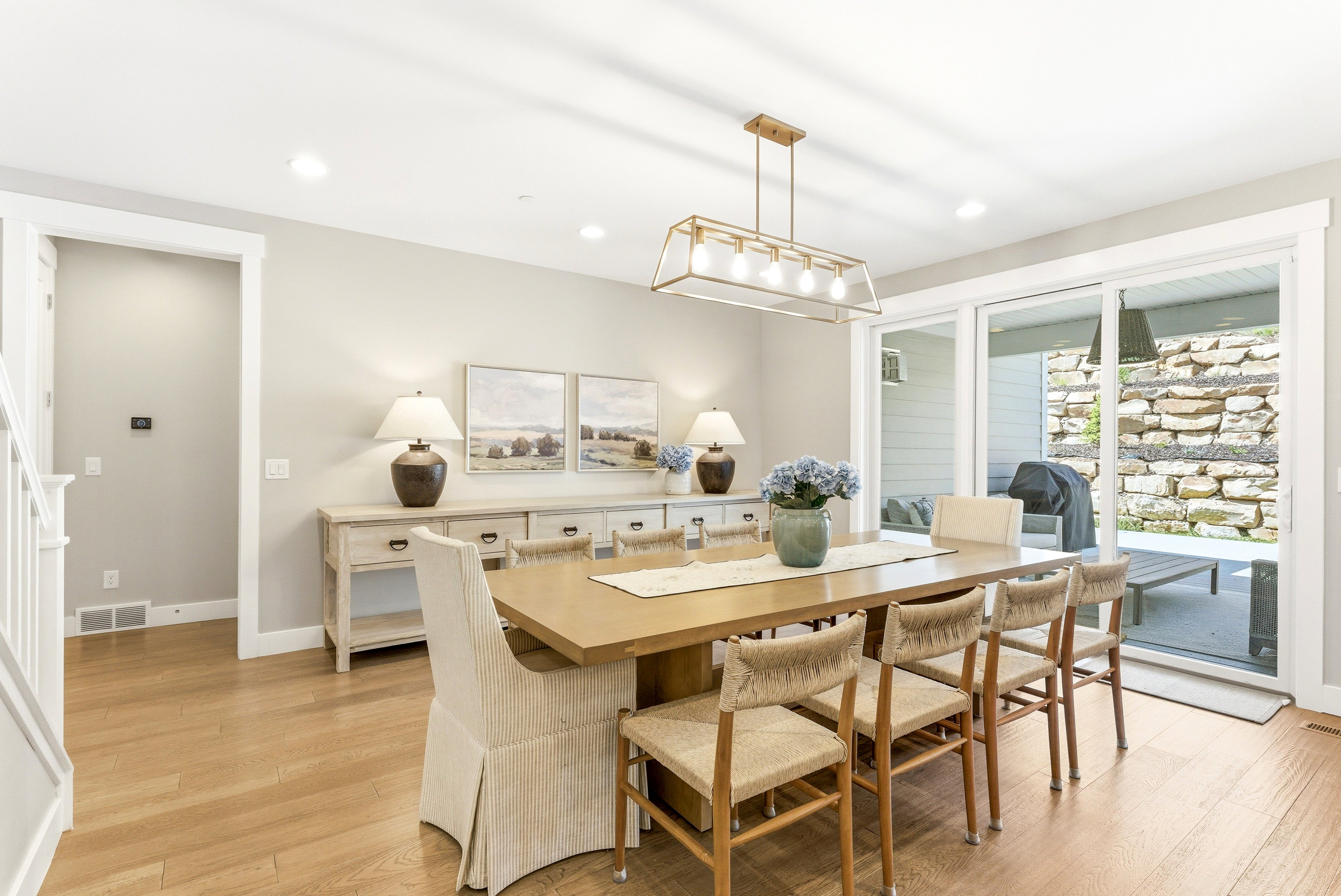 Dining area featuring wood-finish flooring and recessed lighting