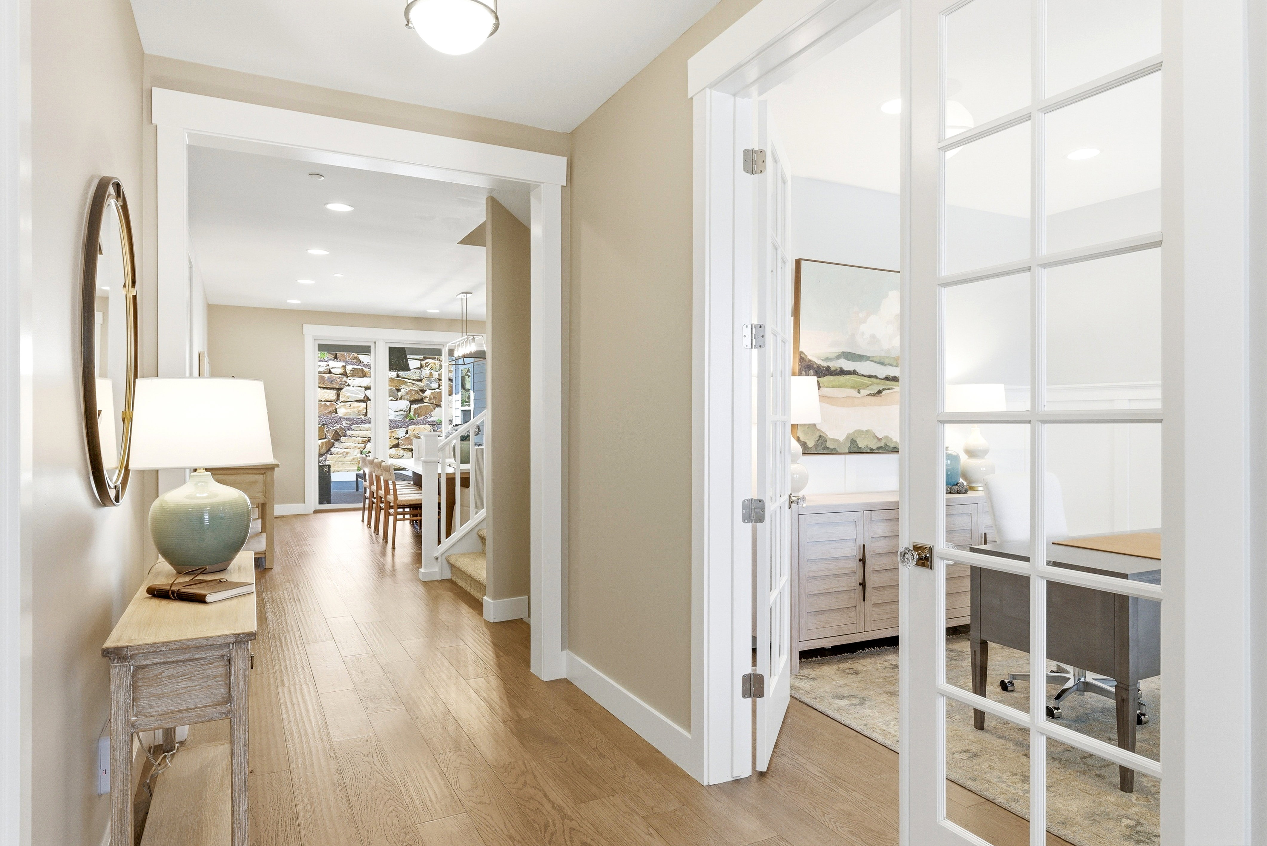 Bright interior hallway with wood-finish flooring