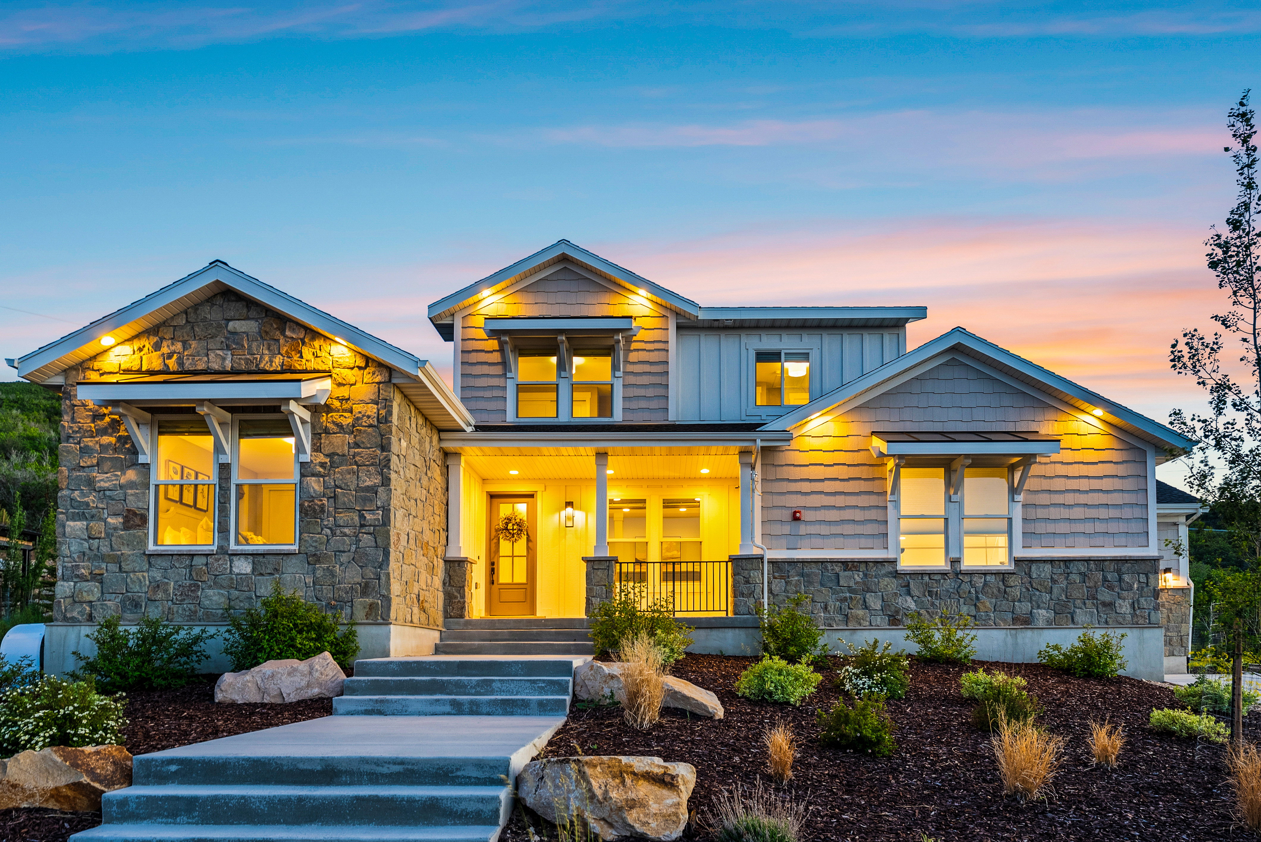 Stone and siding exterior with gabled roof lines