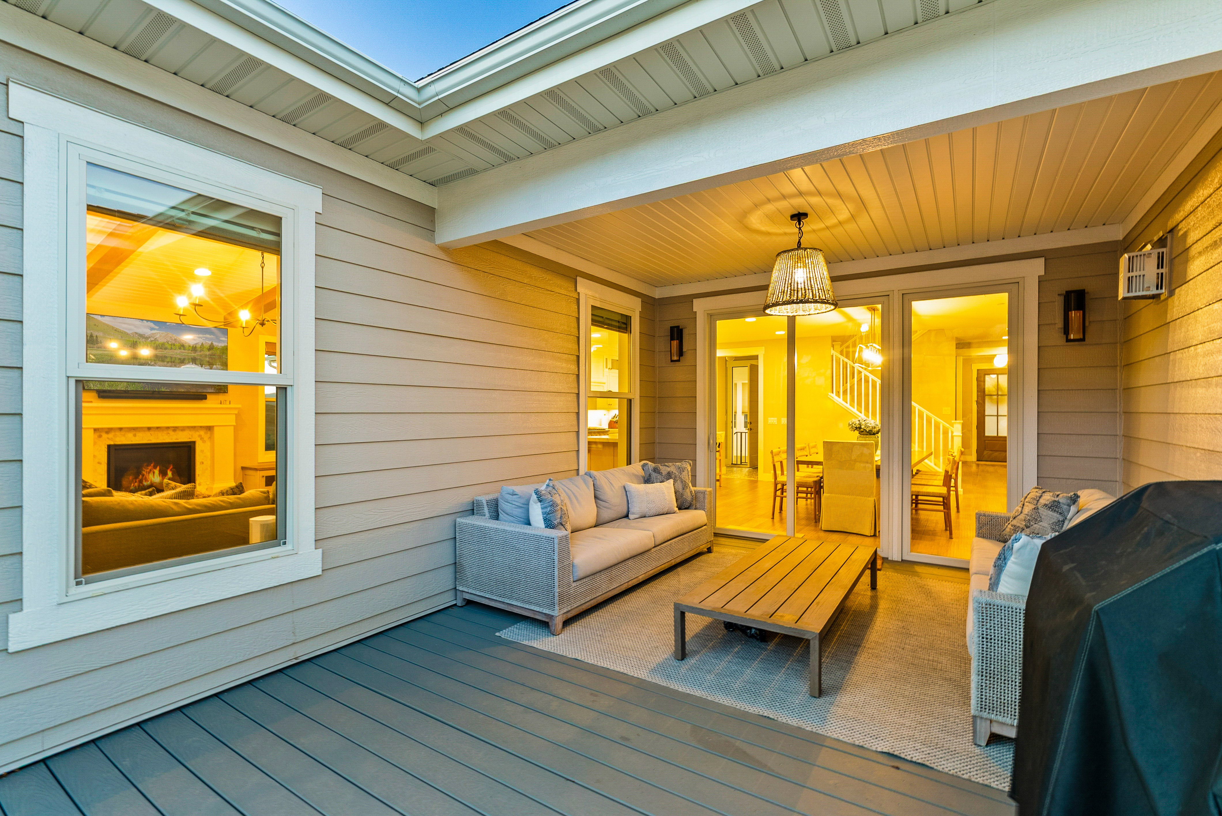 Covered patio featuring a wood-finish floor and horizontal siding