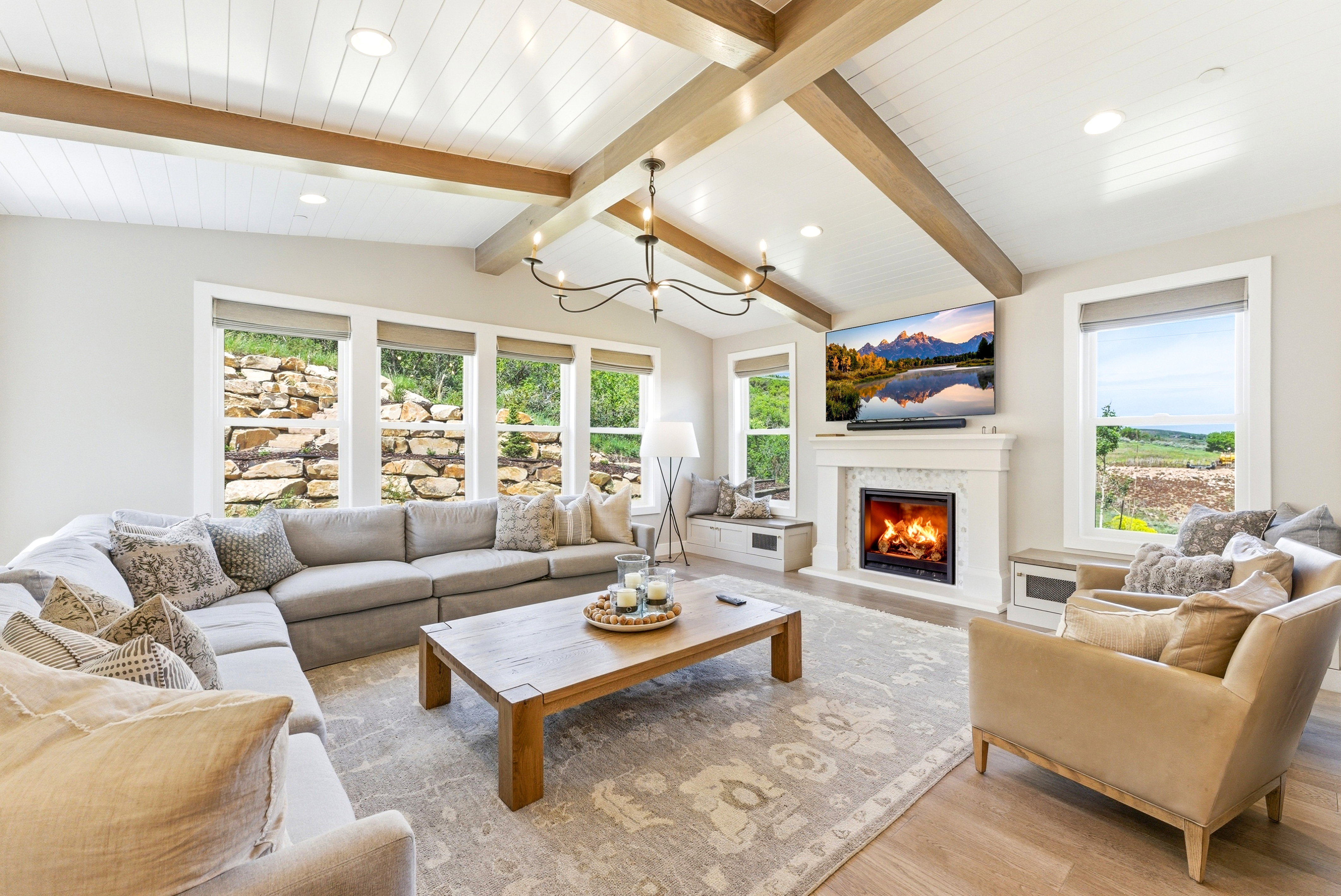 Vaulted ceiling with wood beams and recessed lighting