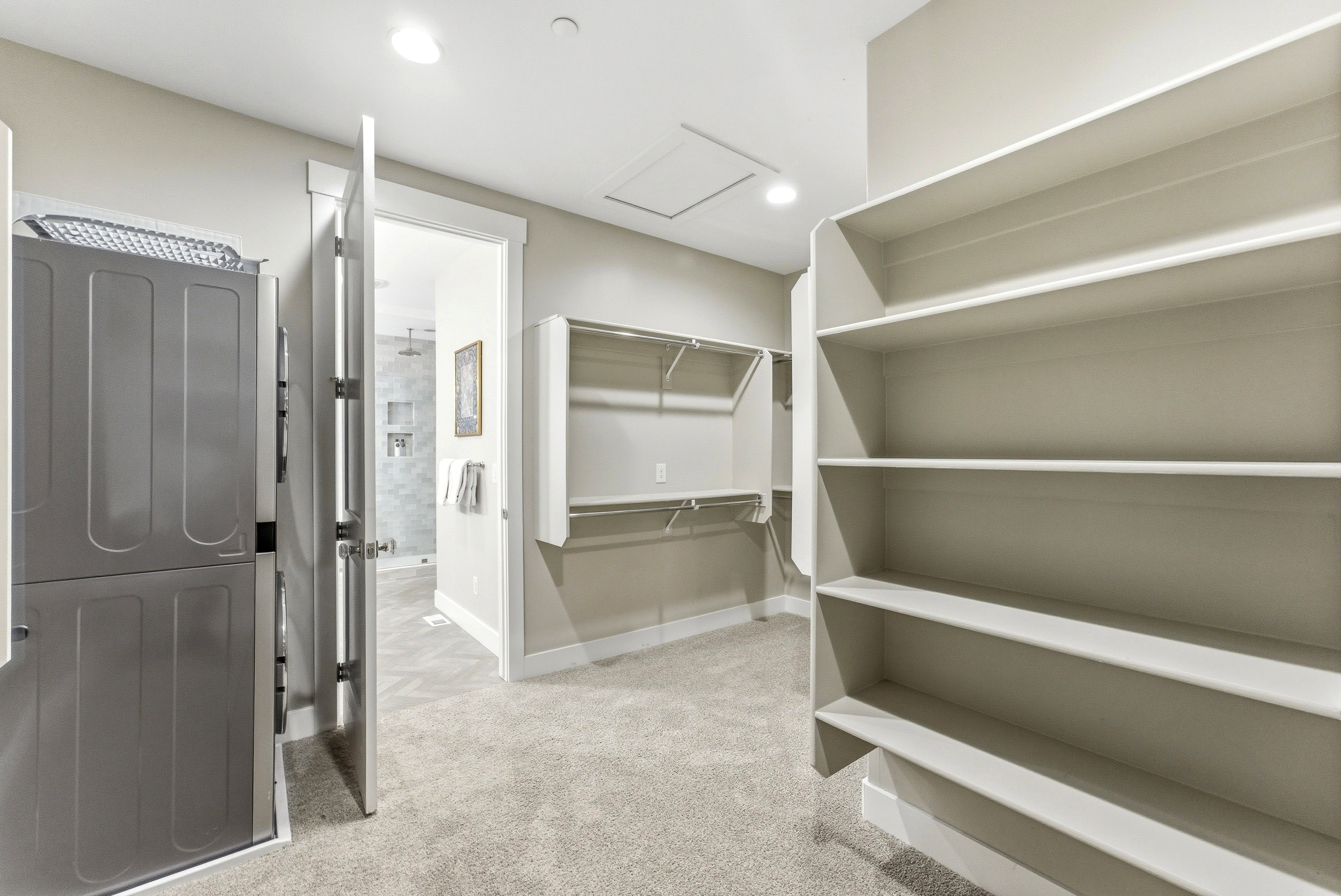 Expansive closet featuring integrated shelving and hanging rods