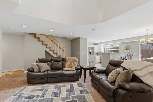 Open-concept living area featuring recessed lighting and neutral-toned walls
