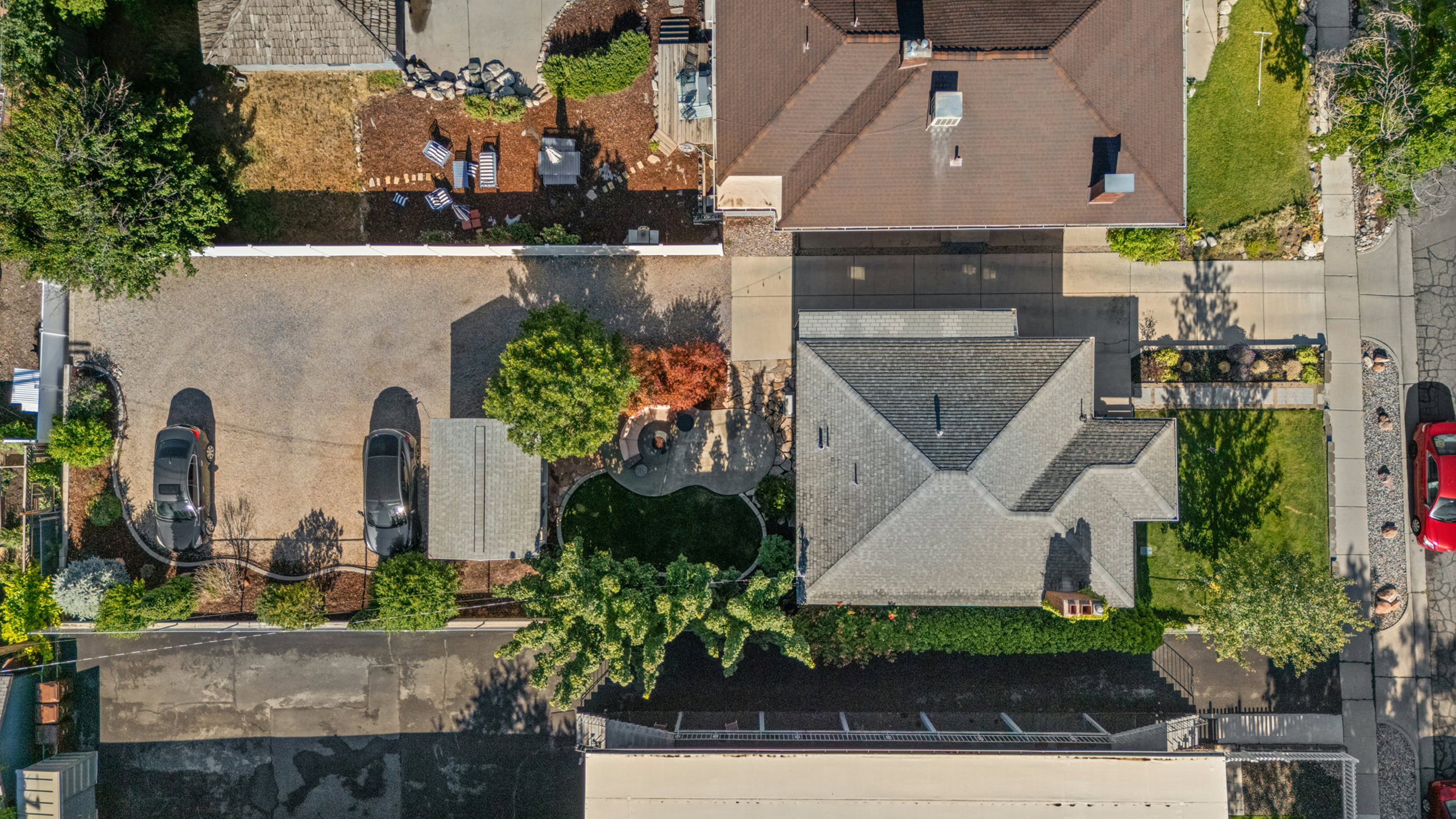 Expansive gravel driveway providing ample parking