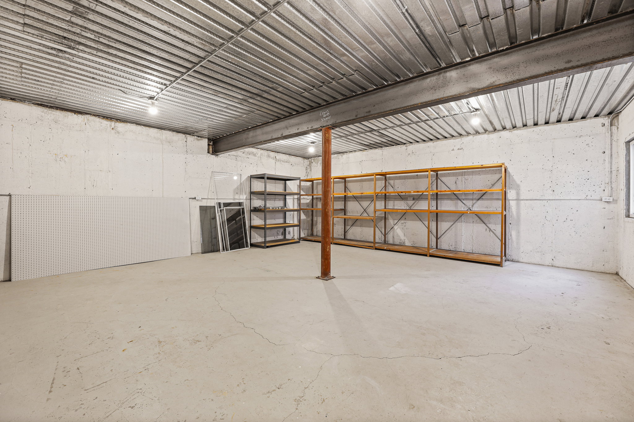 Expansive concrete floor space with exposed concrete walls