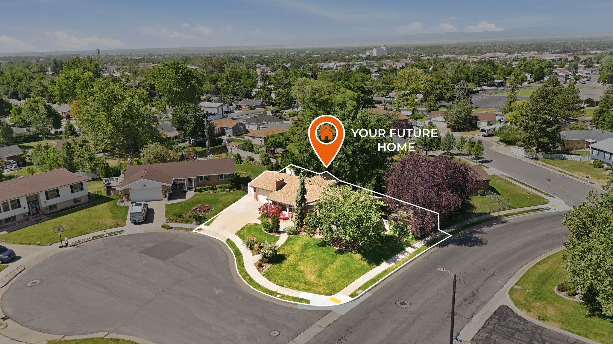 Aerial perspective showcasing a residence with an attached garage, positioned on a corner lot with a cul-de-sac