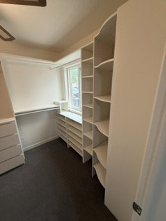 Custom built-in shelving system with integrated window