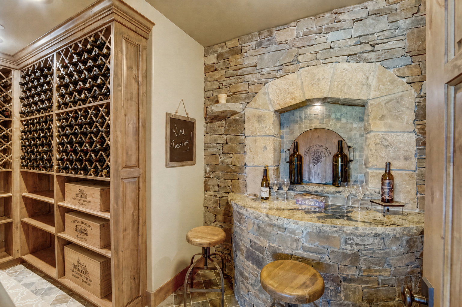 Custom stone accent wall with integrated bar and arched niche
