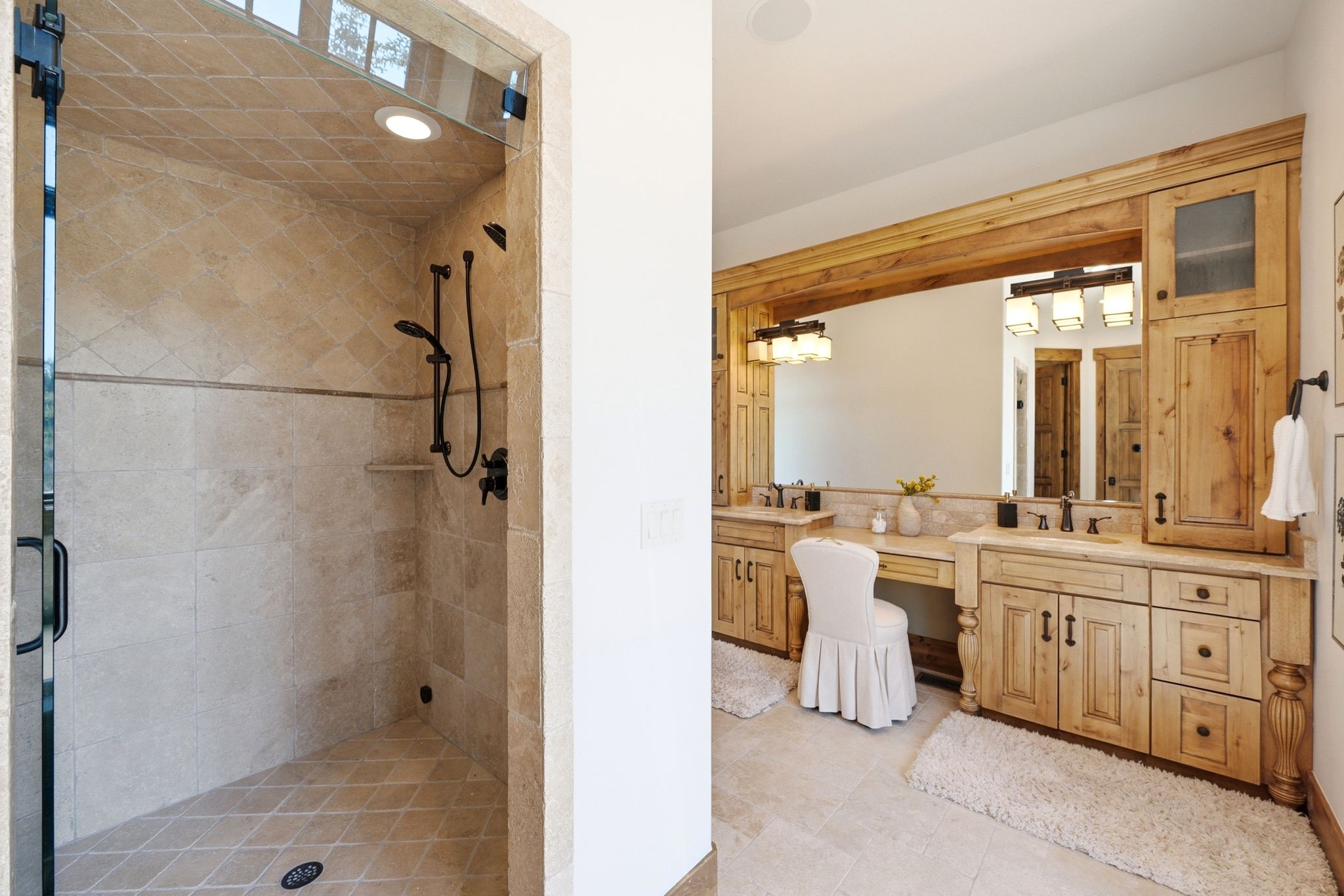 Spacious bathroom featuring a glass-enclosed shower with tile surround and dual shower heads