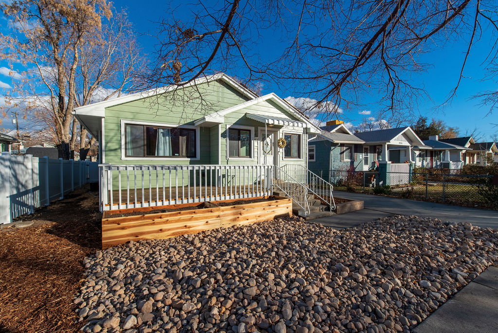Mint green exterior siding with white trim