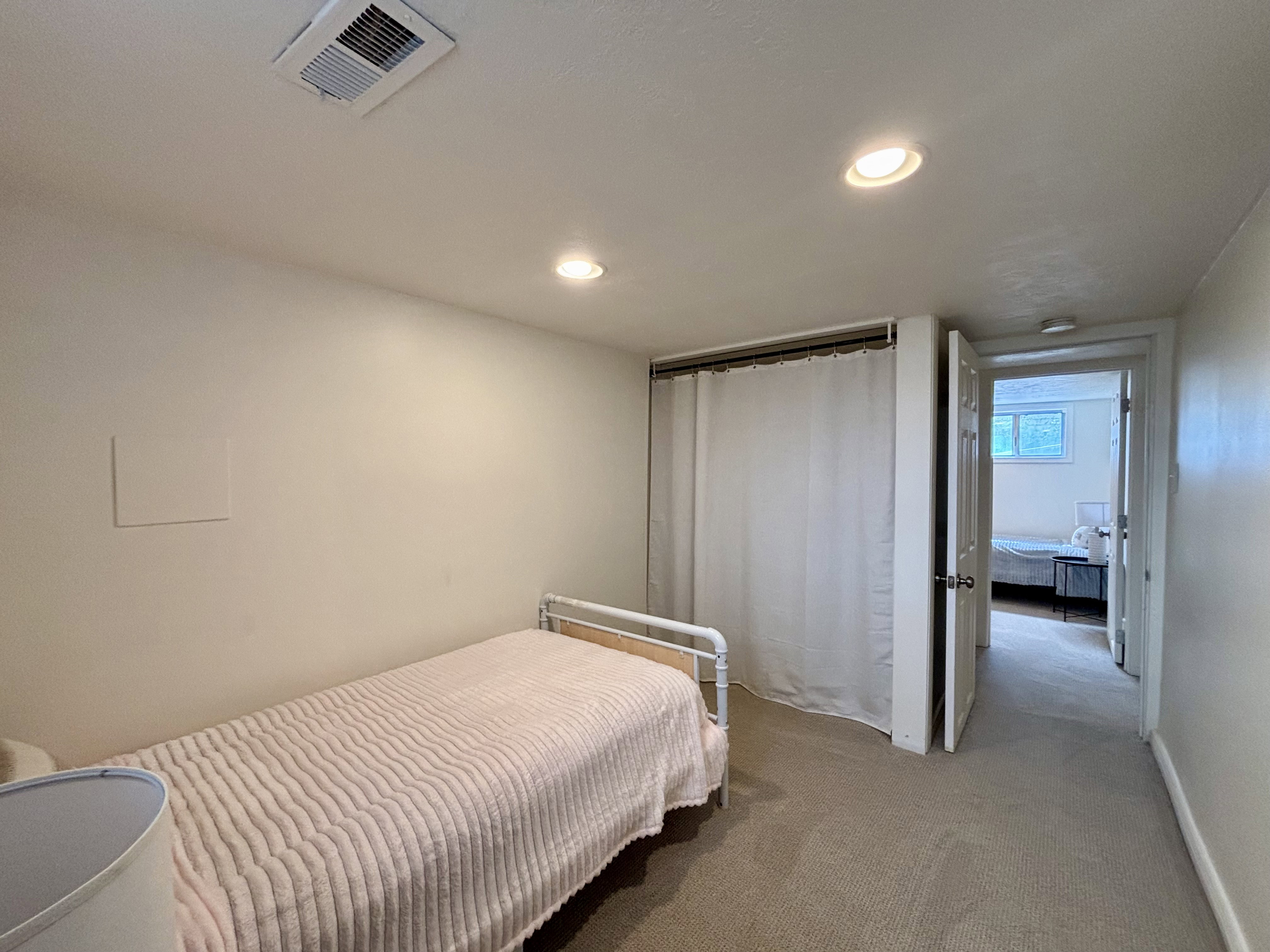 Carpeted room with recessed lighting and a white ceiling