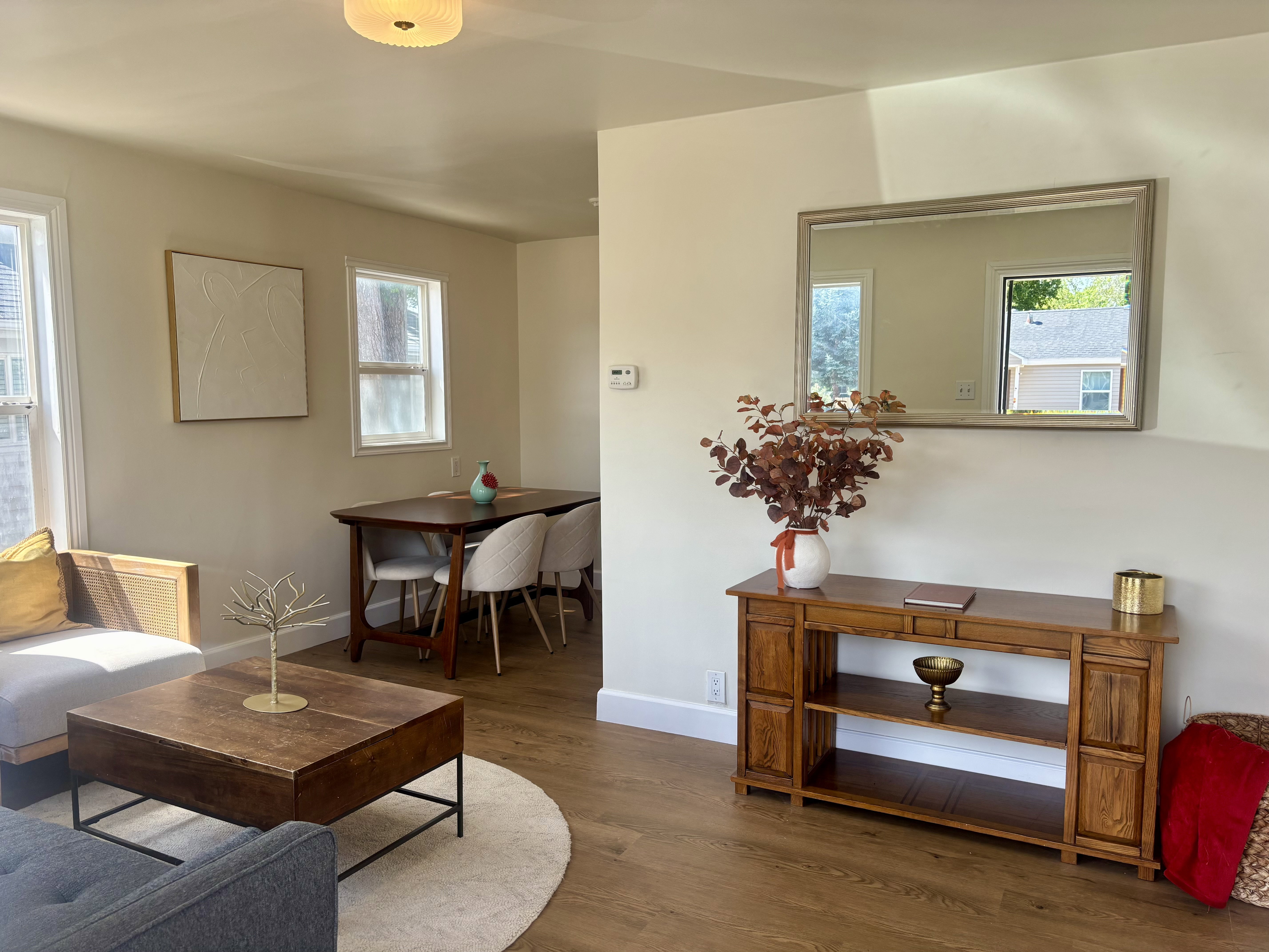 Open concept living area with wood-finish flooring
