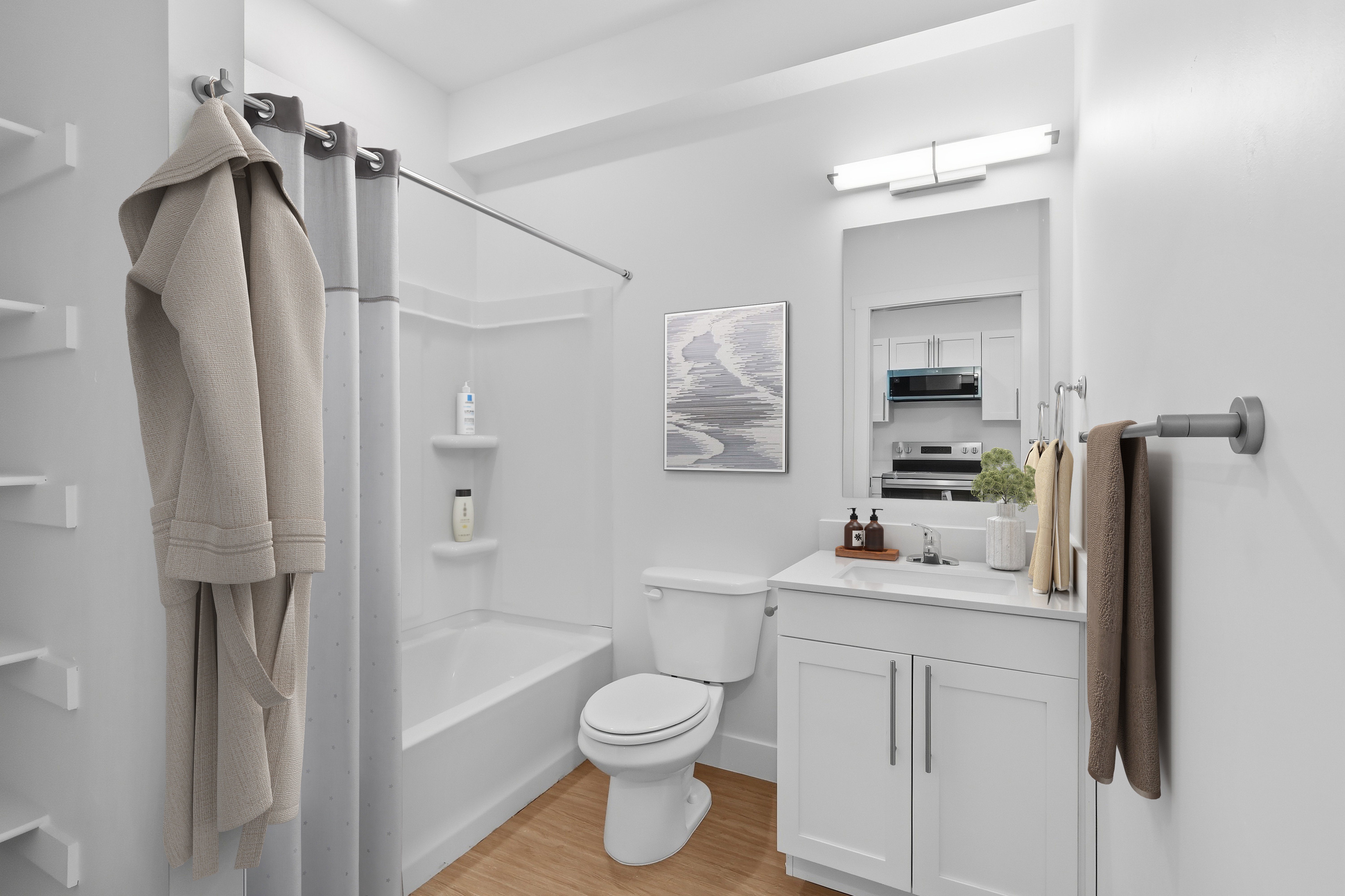 Contemporary bathroom featuring a tub/shower combination with integrated shelving