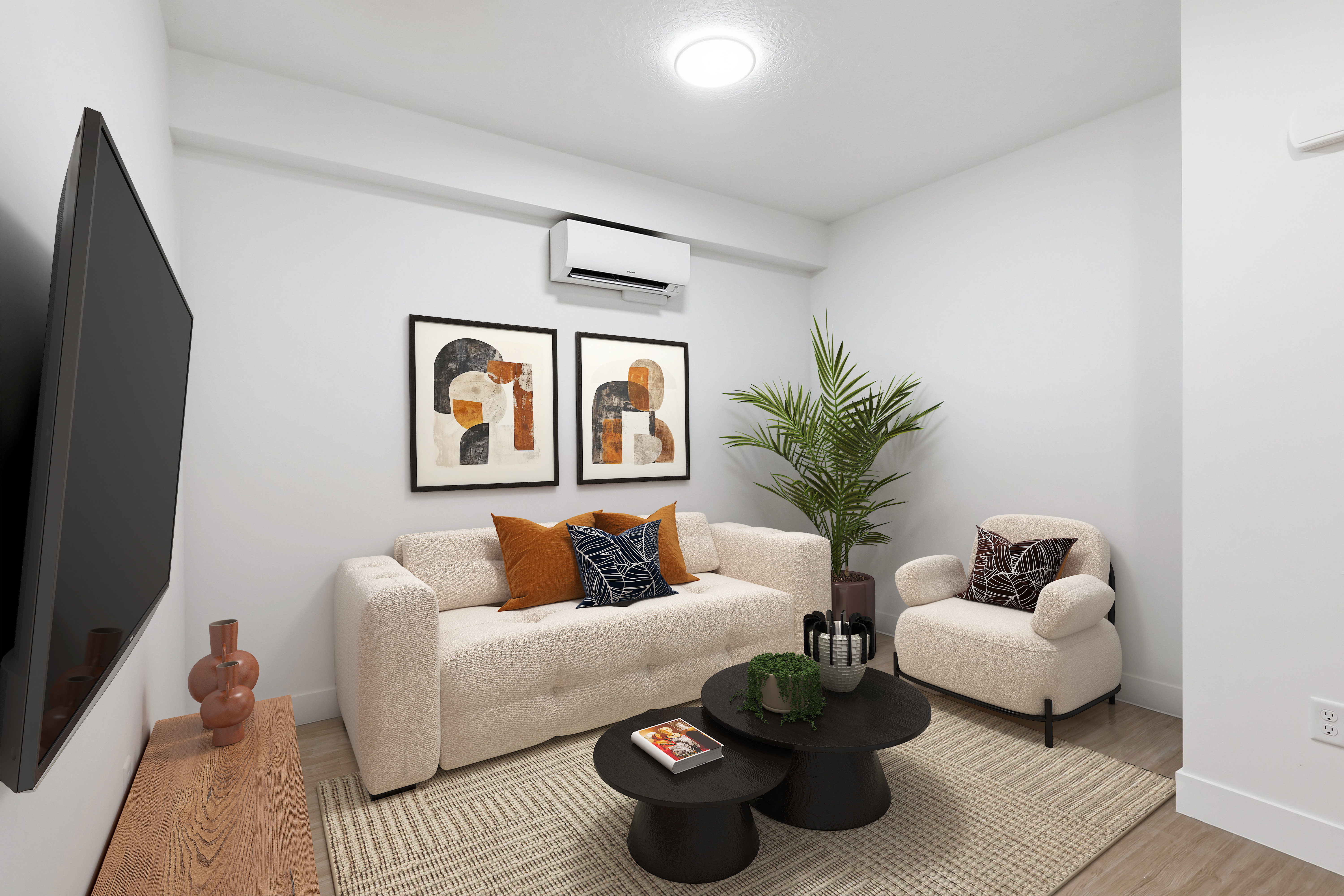 Living space featuring white walls, wood-finish flooring, and a wall-mounted air conditioning unit