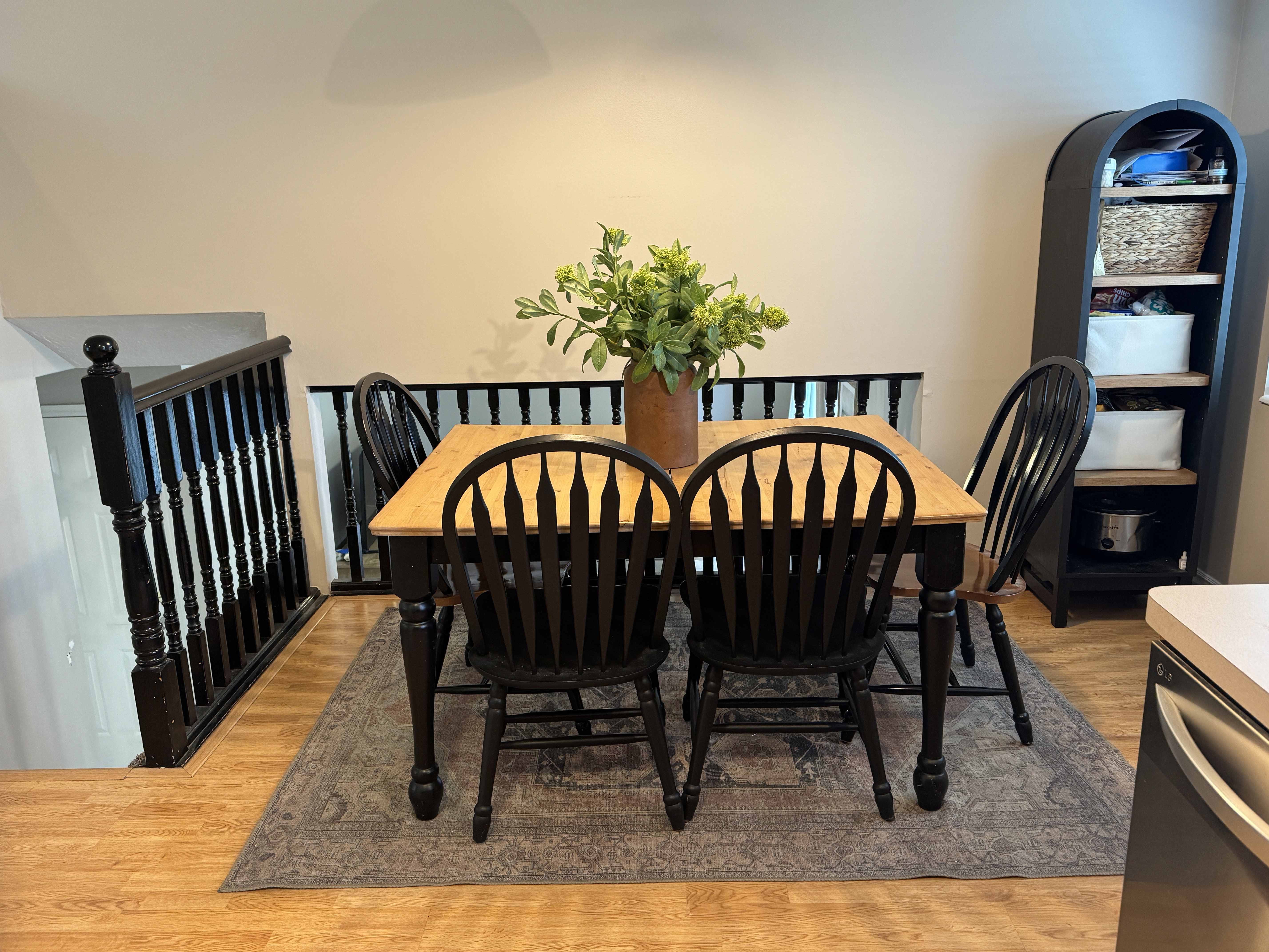 Wood-finish flooring with a decorative area rug