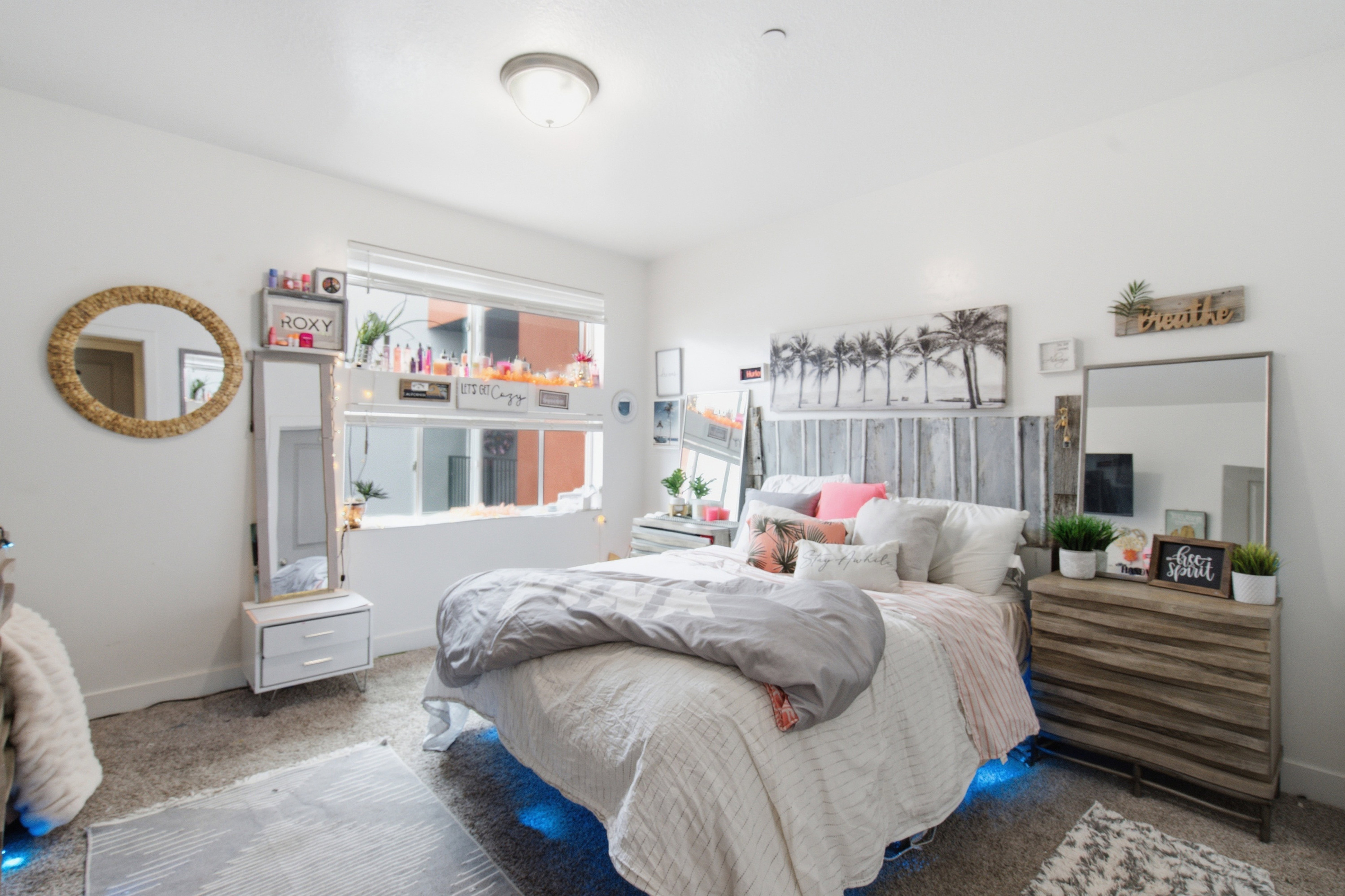 Bedroom featuring a large horizontal window and recessed lighting