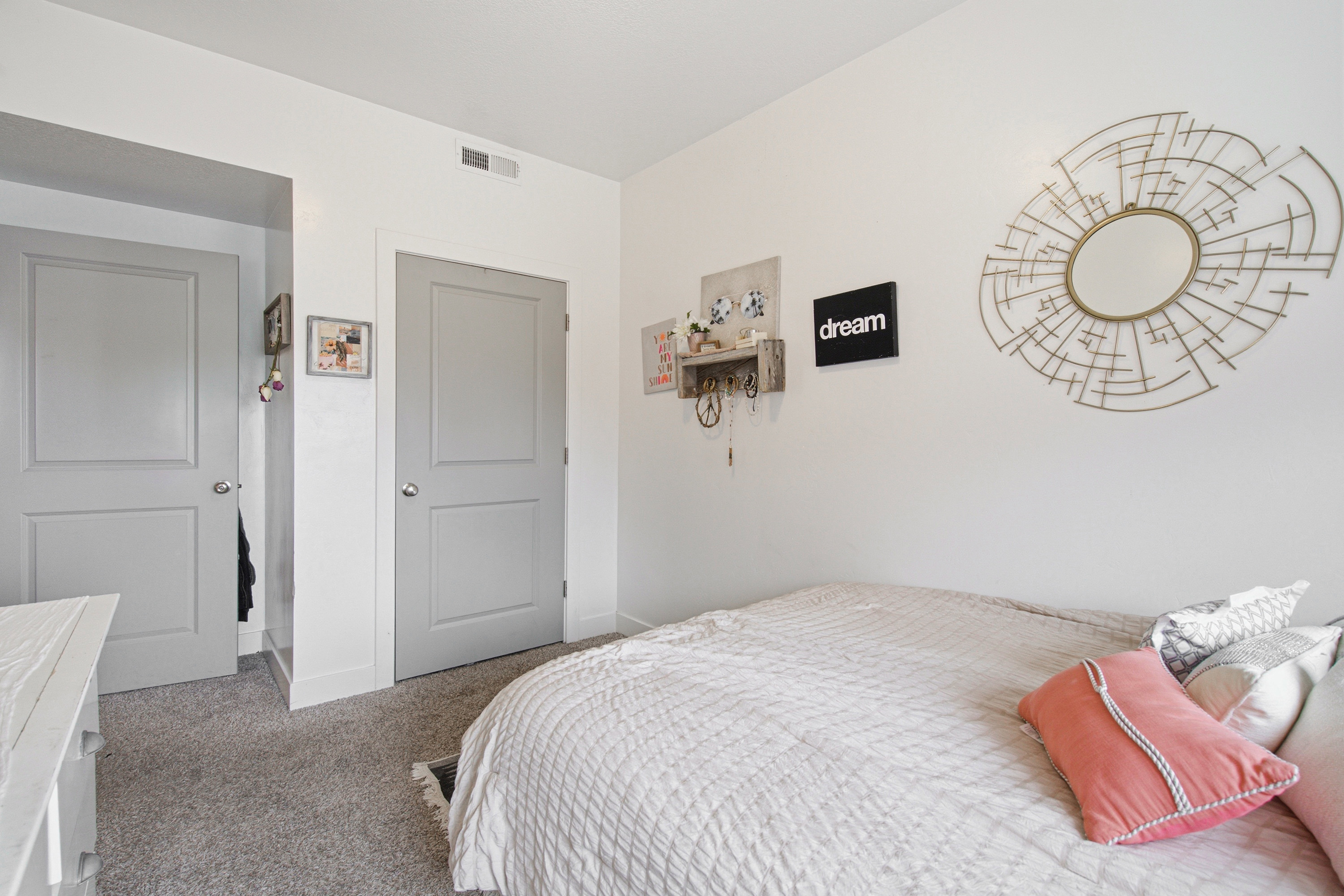 Interior room featuring light gray carpeting and white walls