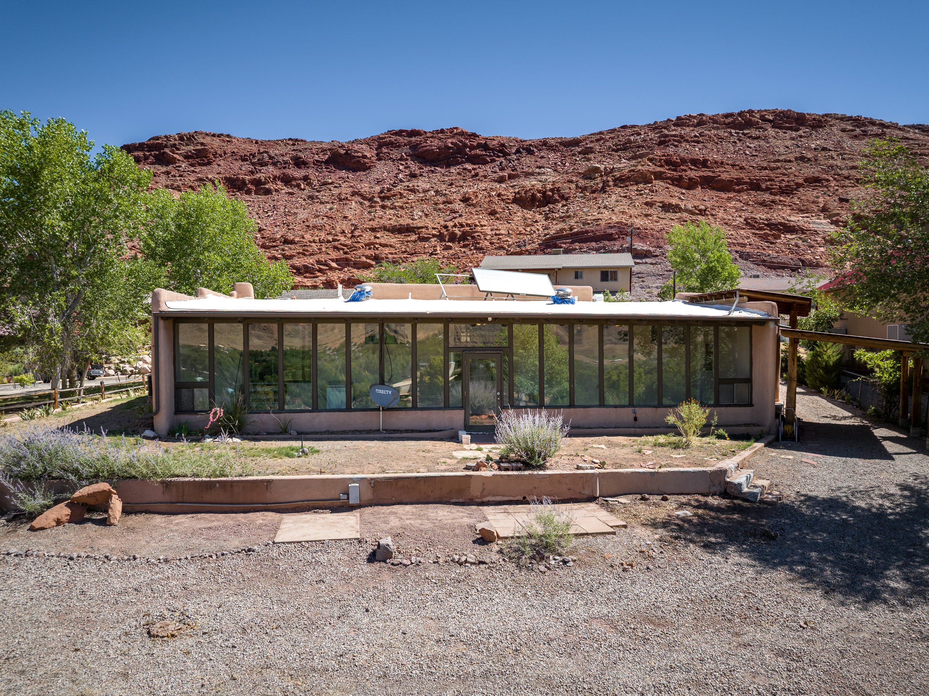 Back of house, atrium featuring red rock