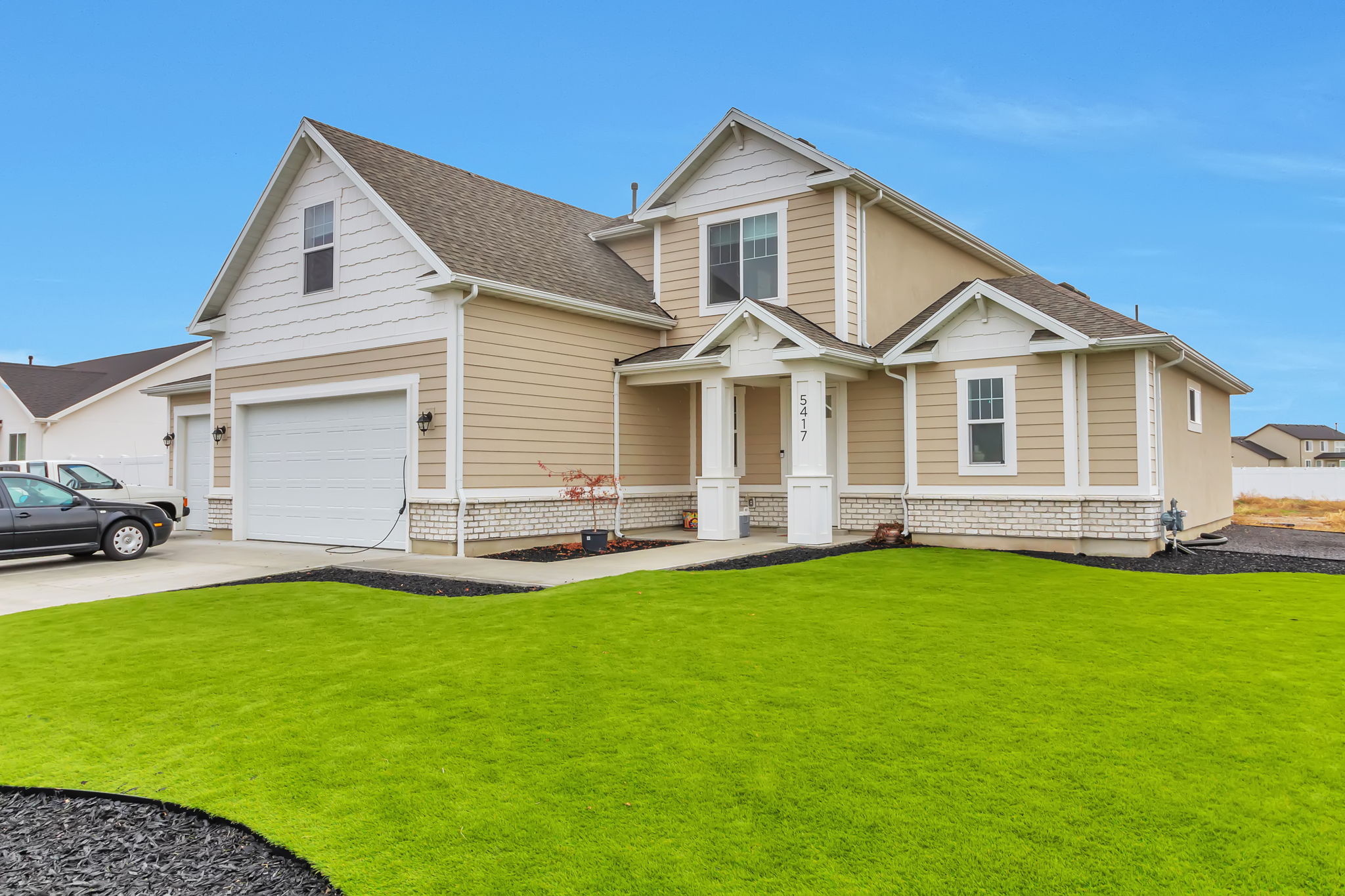 Professionally designed landscaping in front yard
