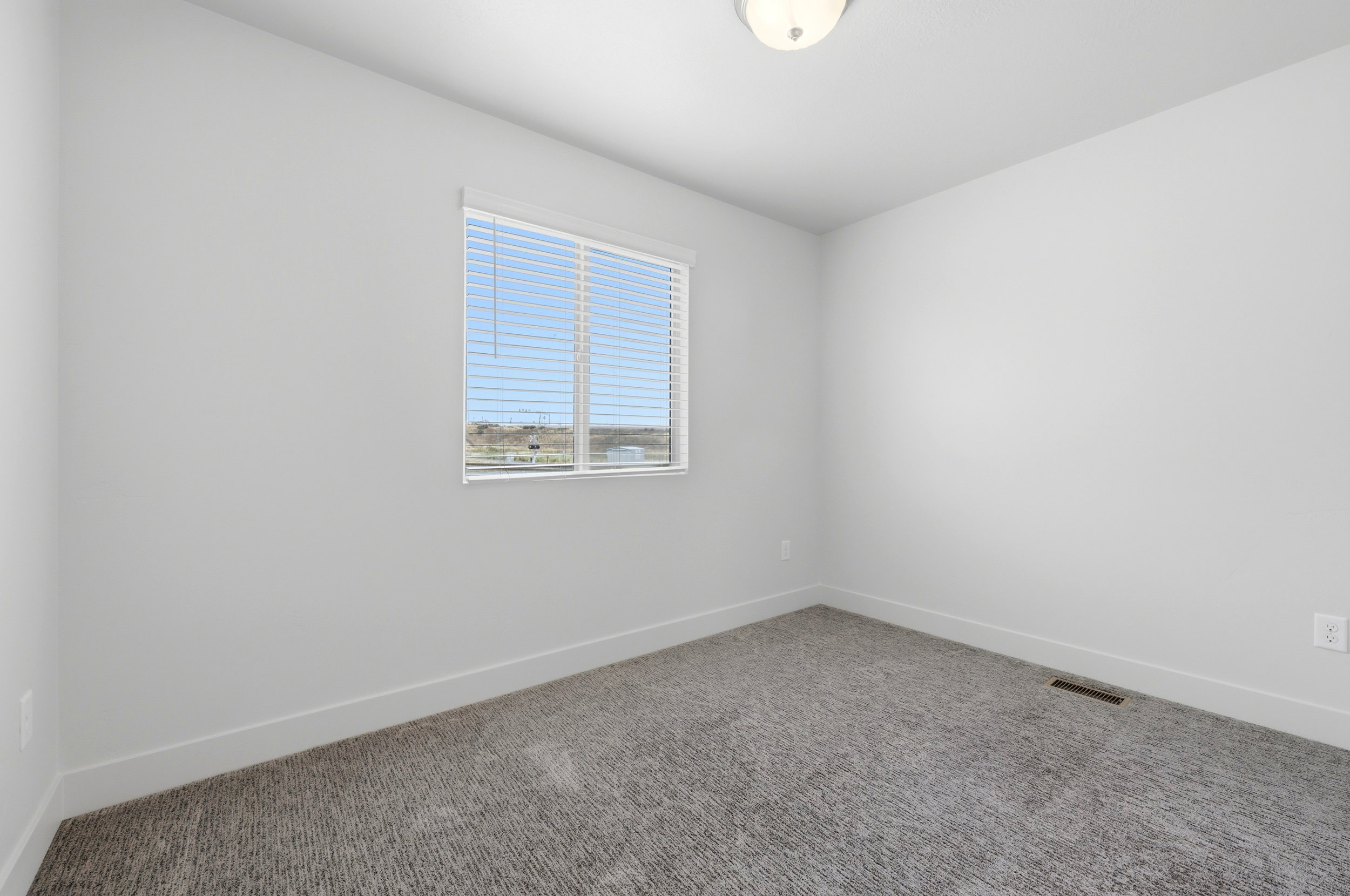 Neutral white walls with matching baseboards