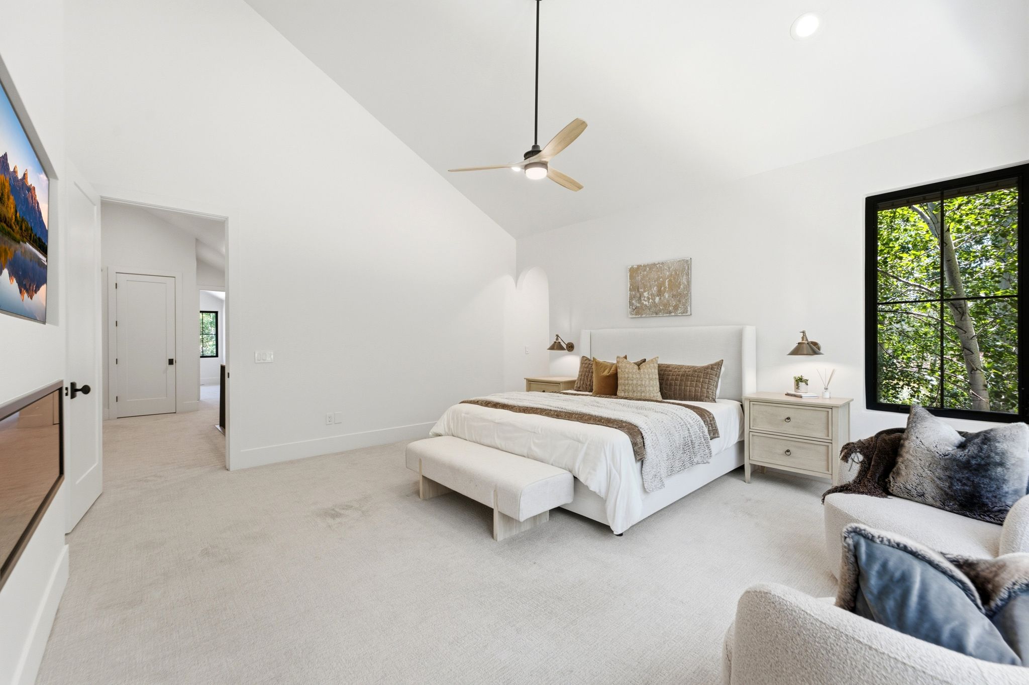 Vaulted white ceilings featuring a modern ceiling fan and recessed lighting