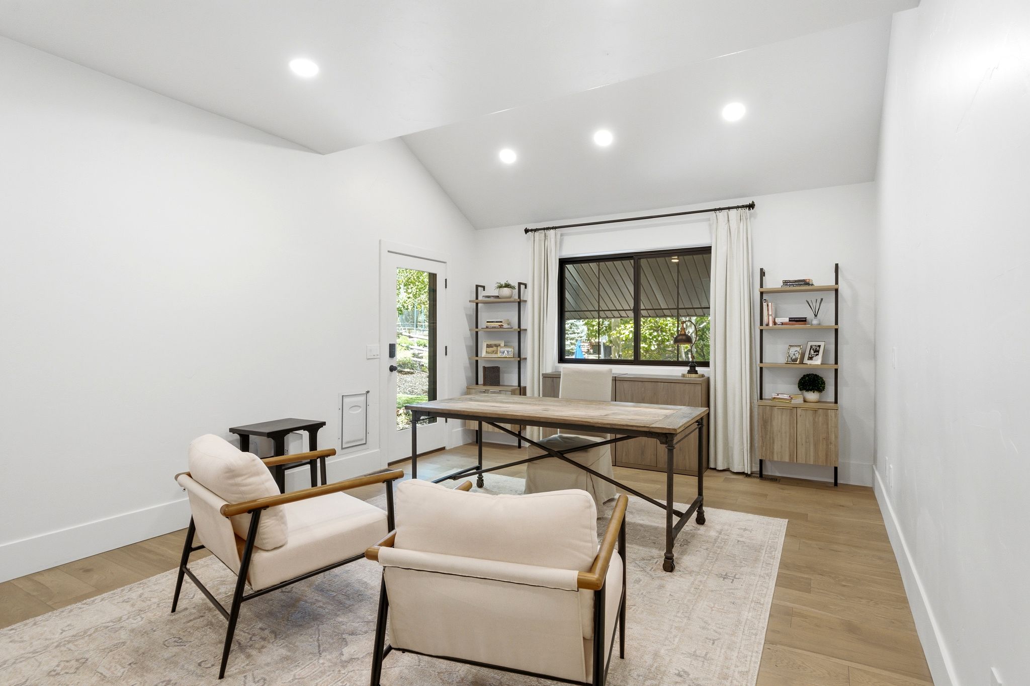 Vaulted ceiling room featuring recessed lighting and wood-finish flooring