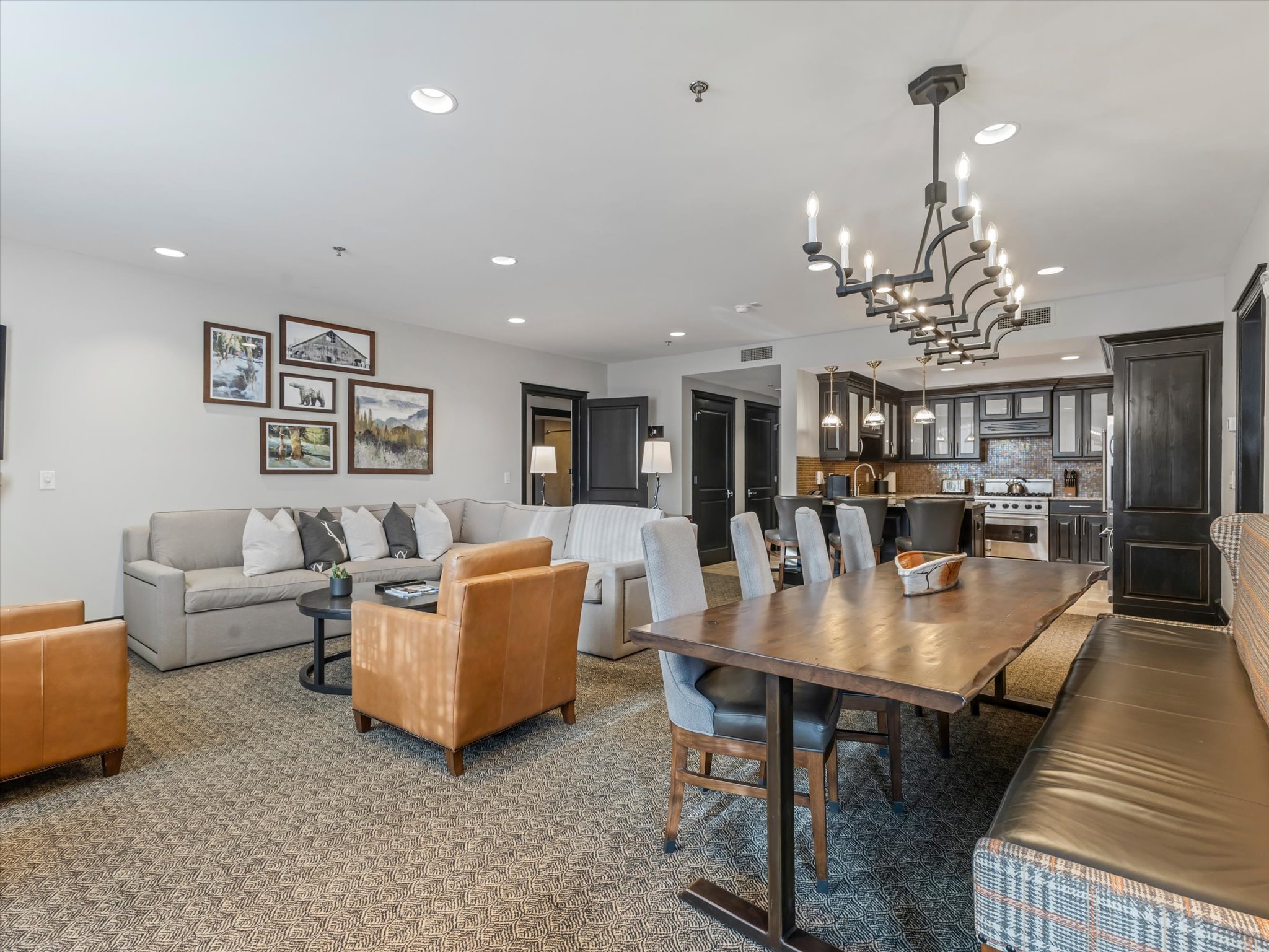 Open-concept living area featuring a kitchen, dining space, and lounge area