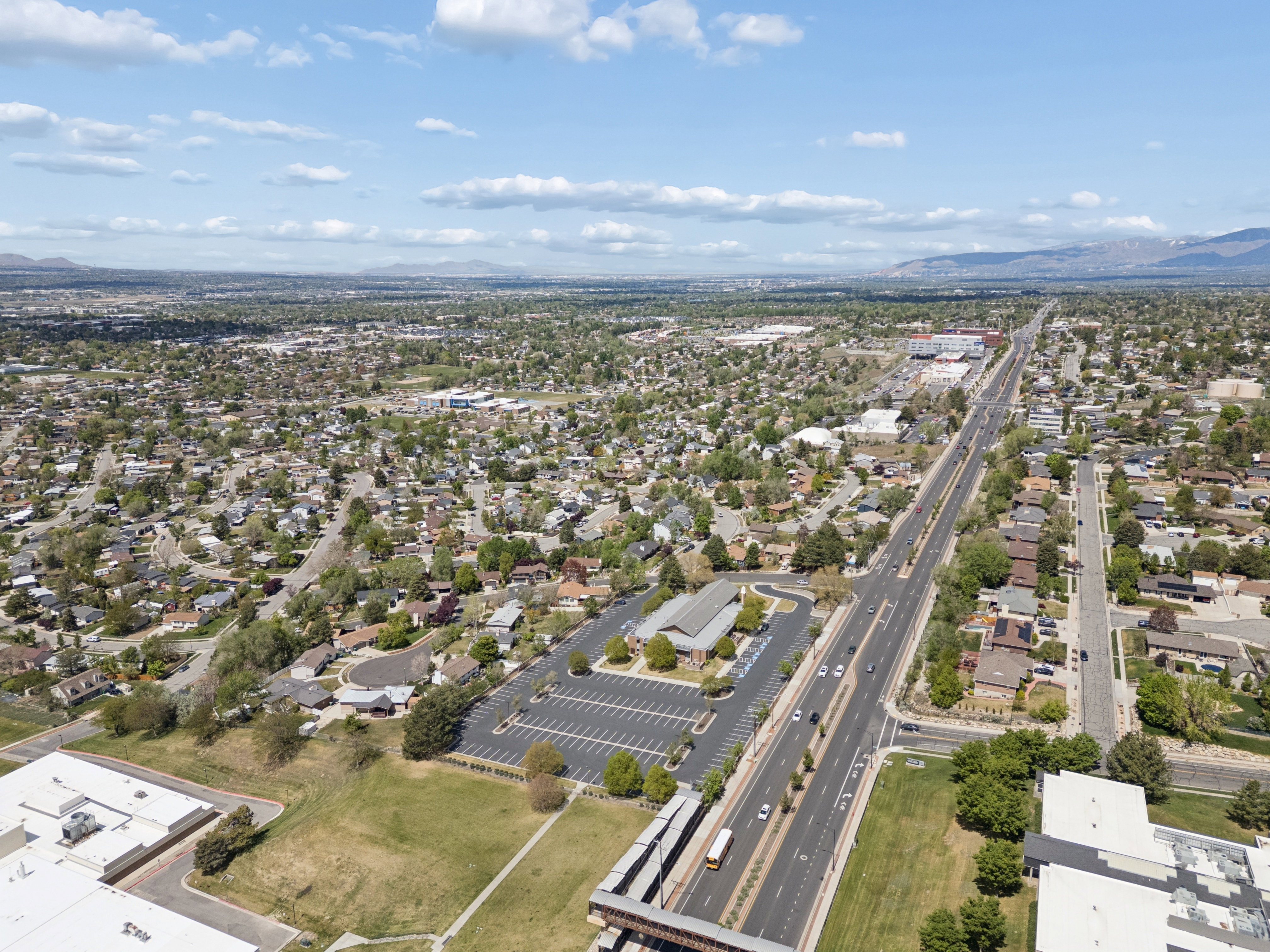 Aerial perspective showcasing an expansive urban landscape with residential and commercial areas