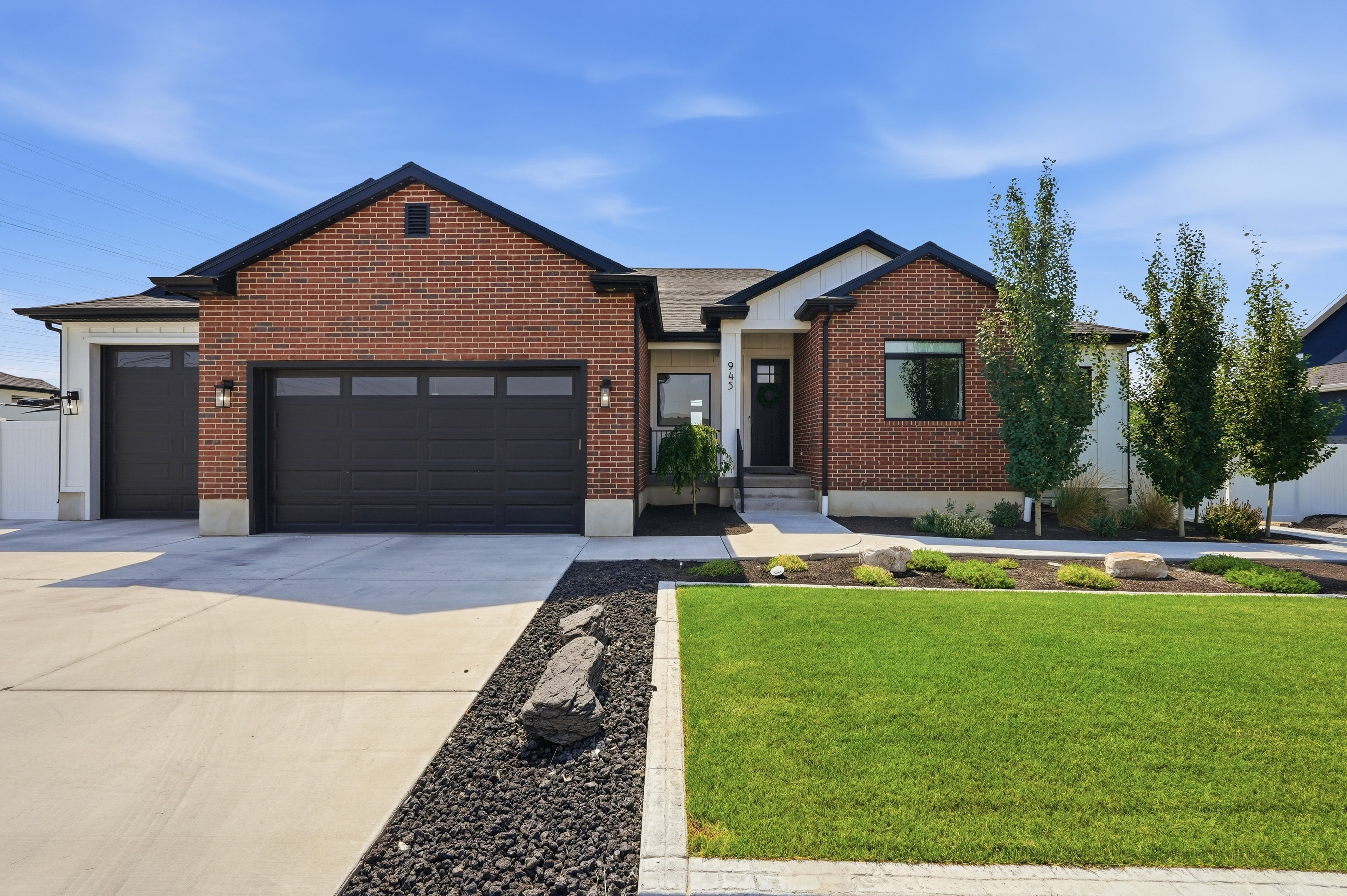 Modern exterior featuring brick and white siding accents