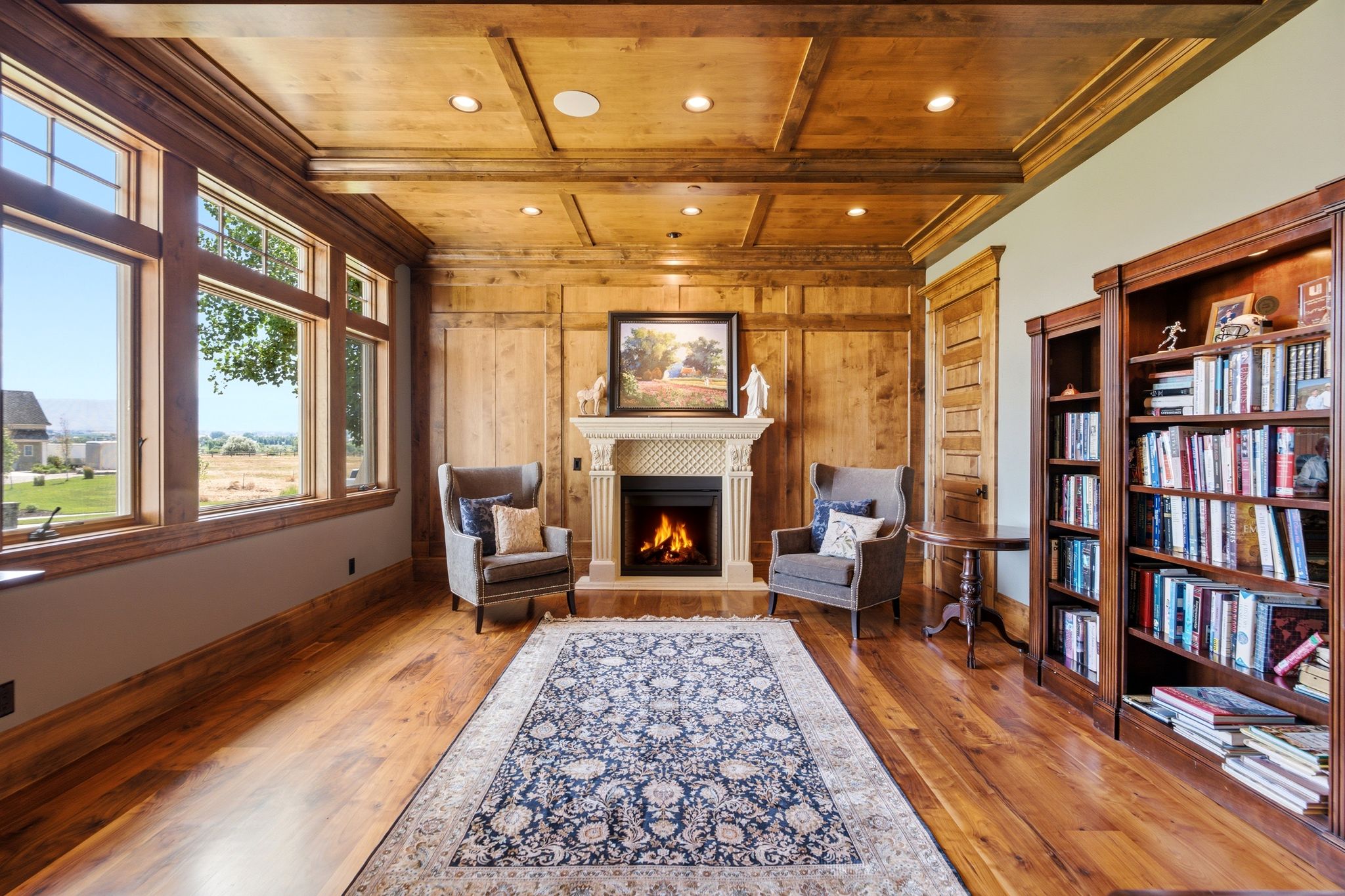 Room featuring extensive wood-paneled walls and ceiling with recessed lighting