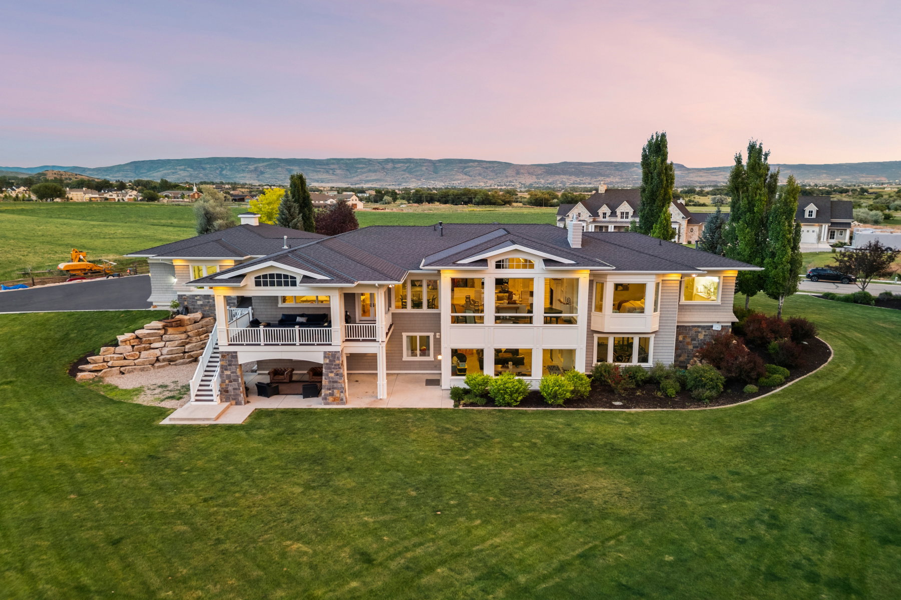 Spacious property featuring a multi-level exterior, extensive lawn, and mature landscaping
