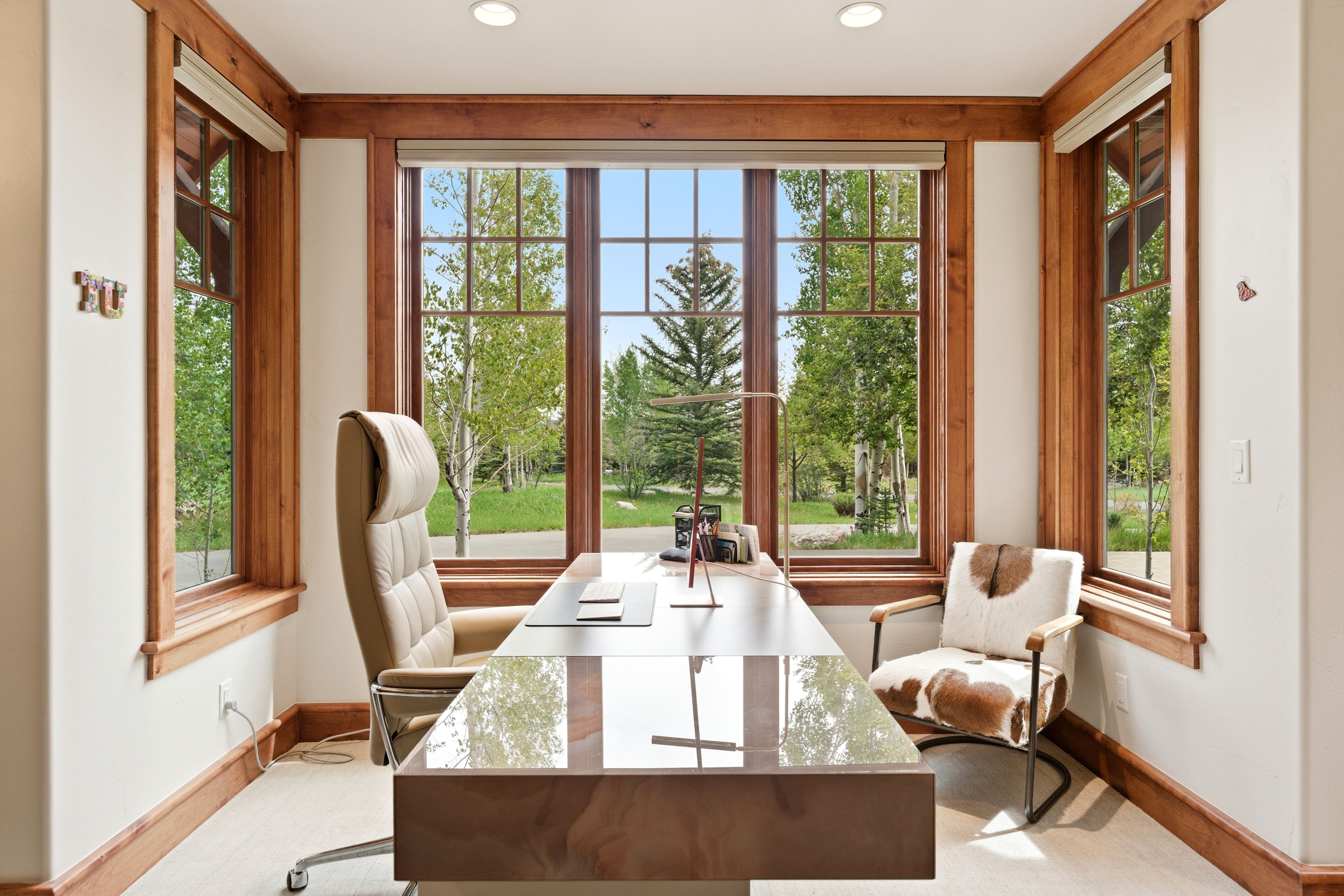 Room featuring extensive natural wood trim and framing