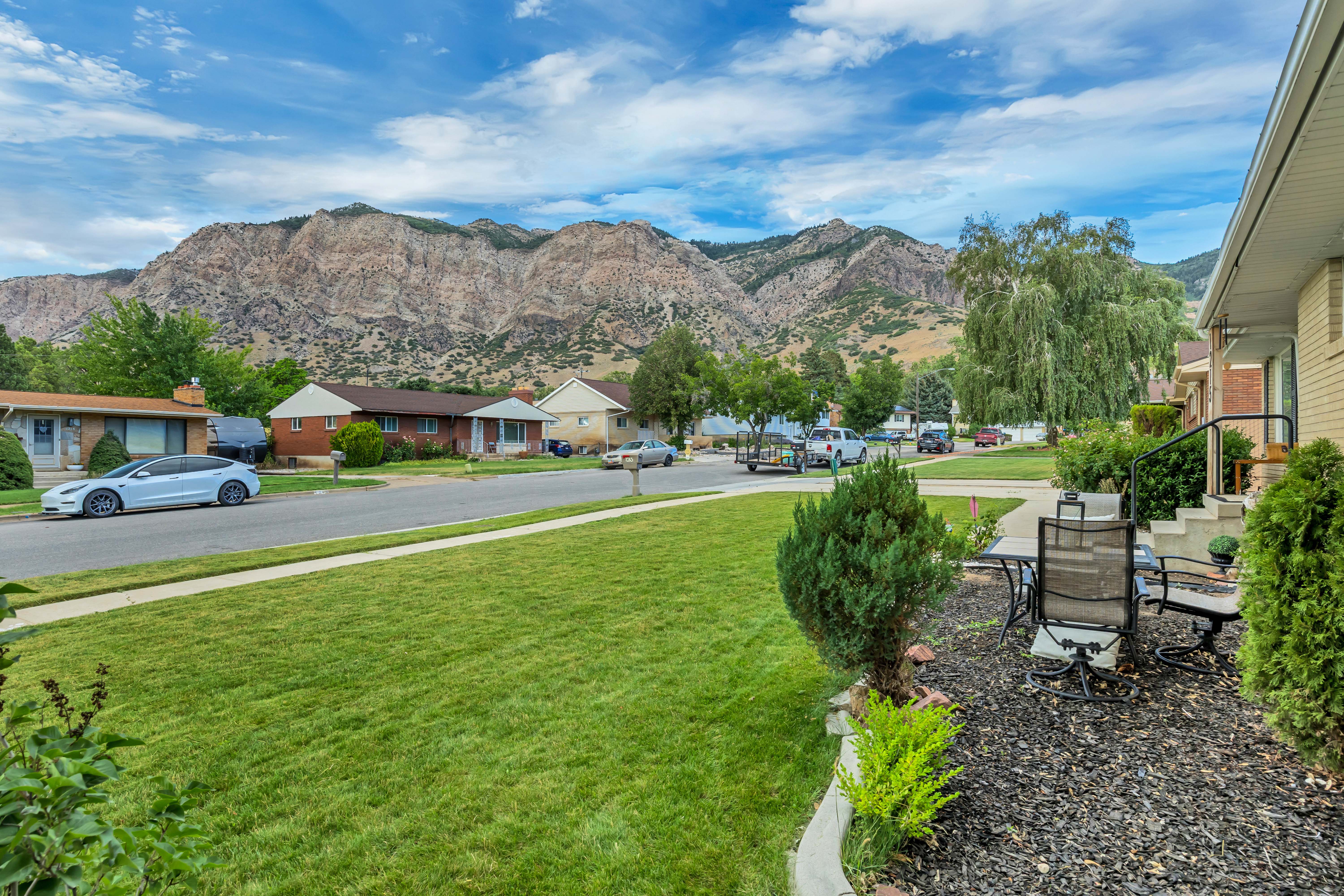 Expansive front lawn with a manicured finish