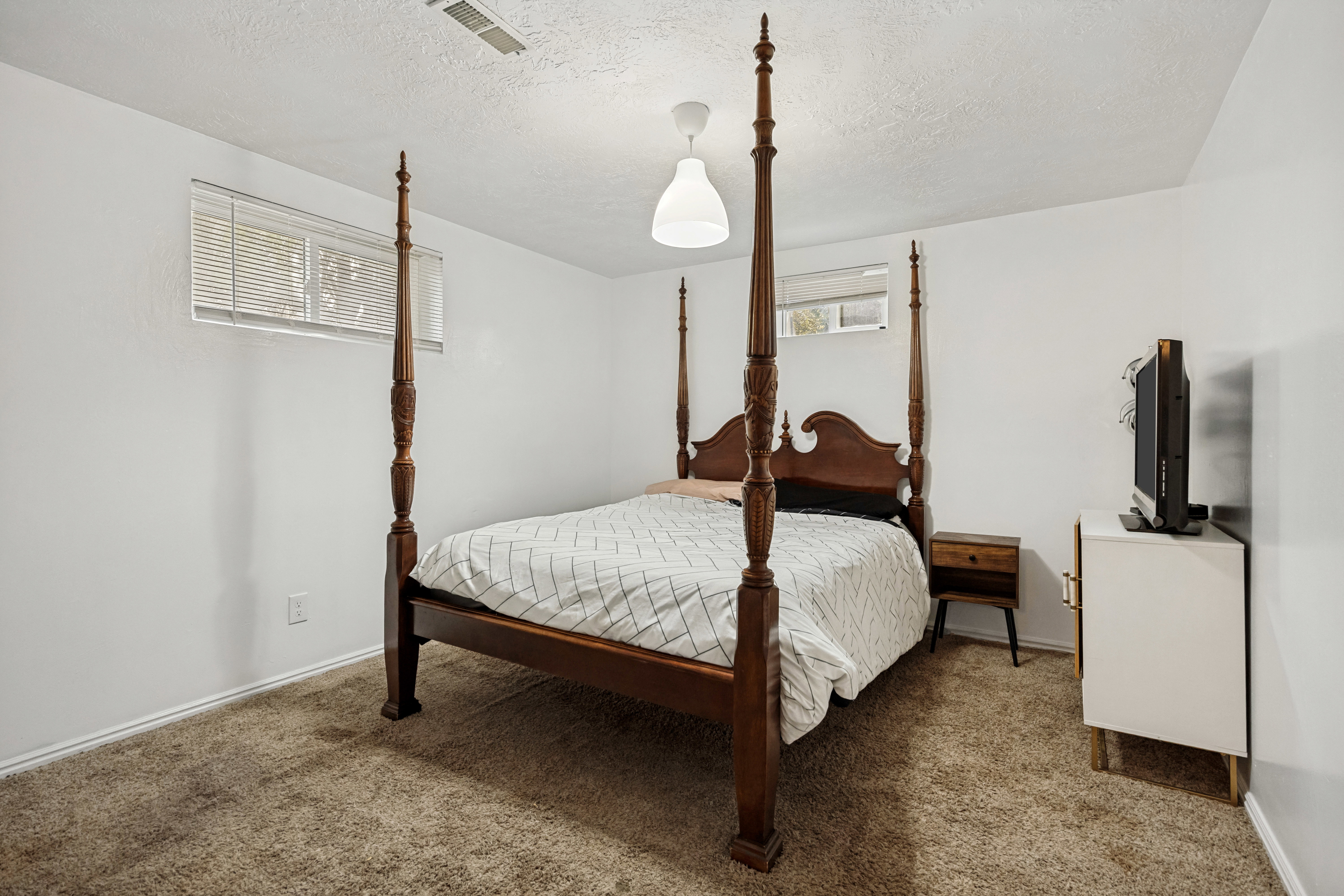 Bright white walls complemented by textured carpeting