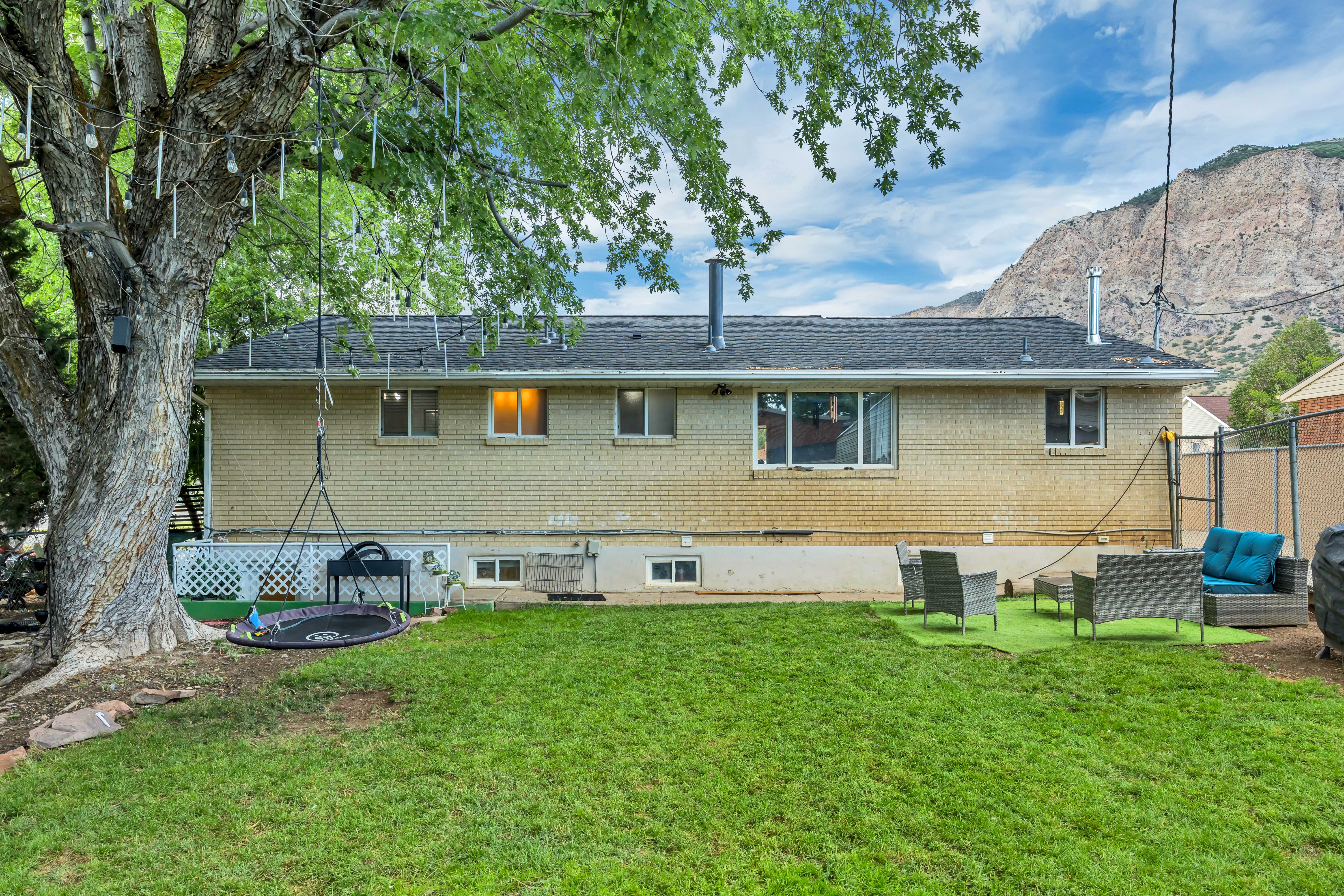 Expansive green lawn with mountain backdrop