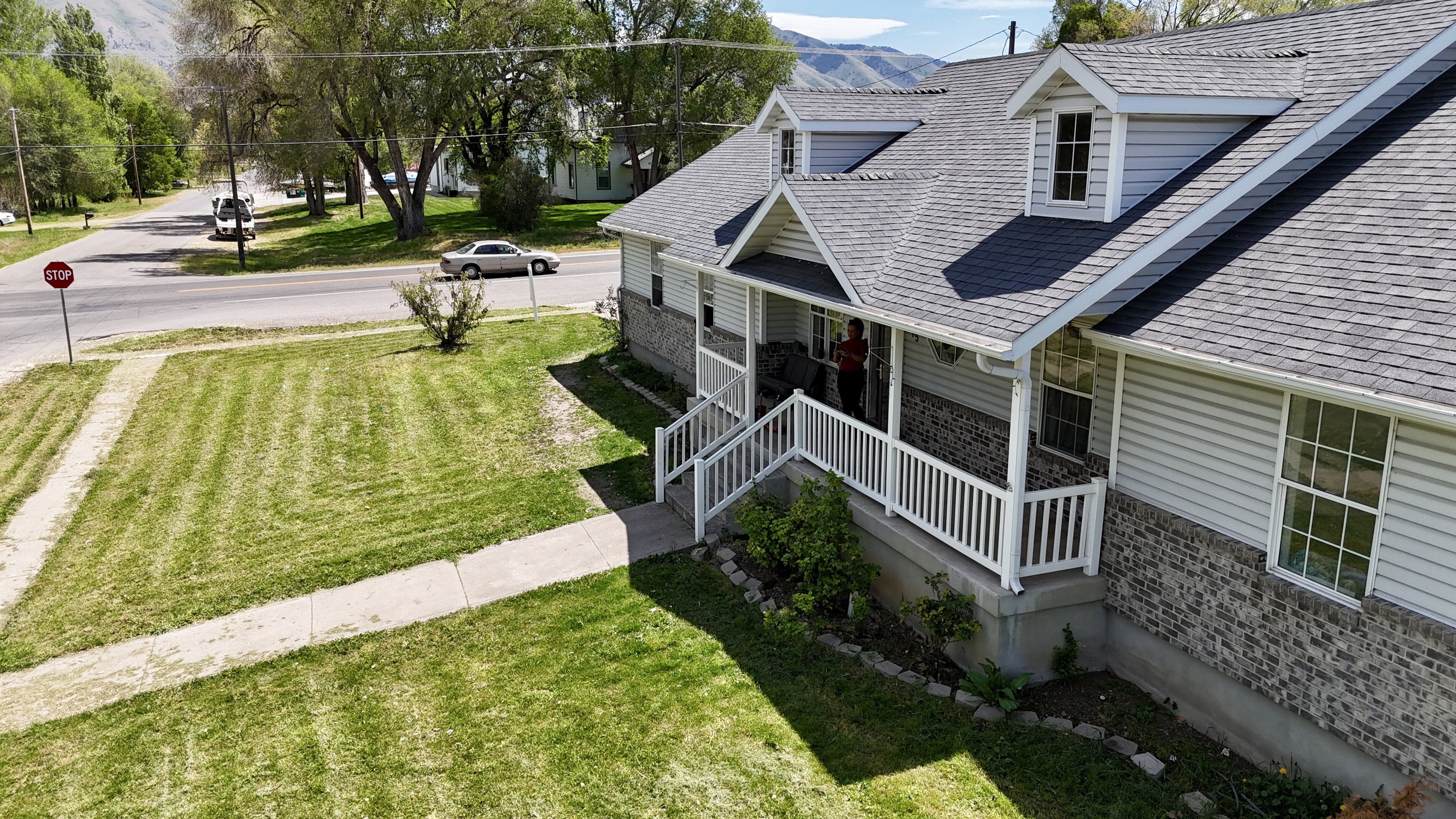 Charming exterior with gray siding and stone veneer