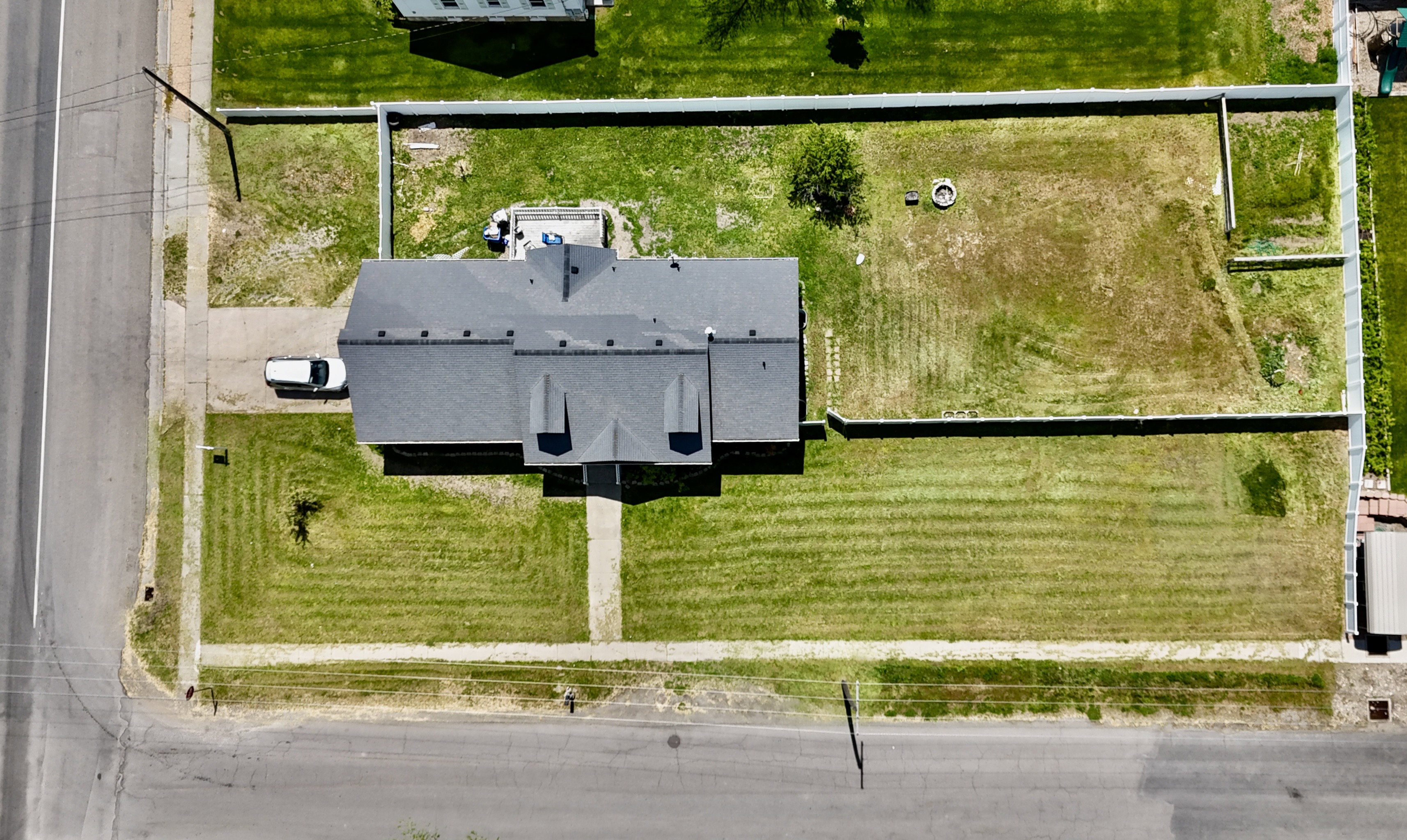 Property with expansive green spaces and a large, fenced rear yard
