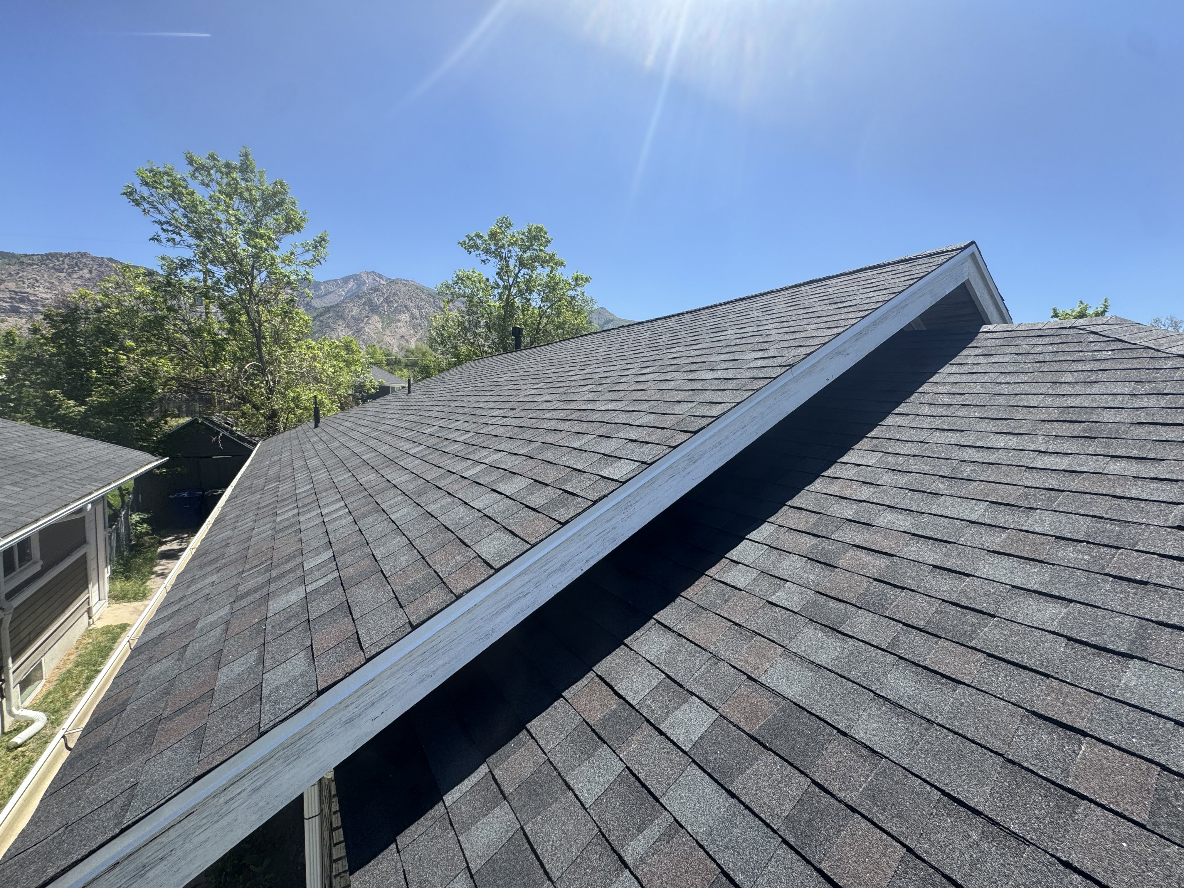 Architectural shingle roofing with a multi-tone gray finish. BRAND NEW!