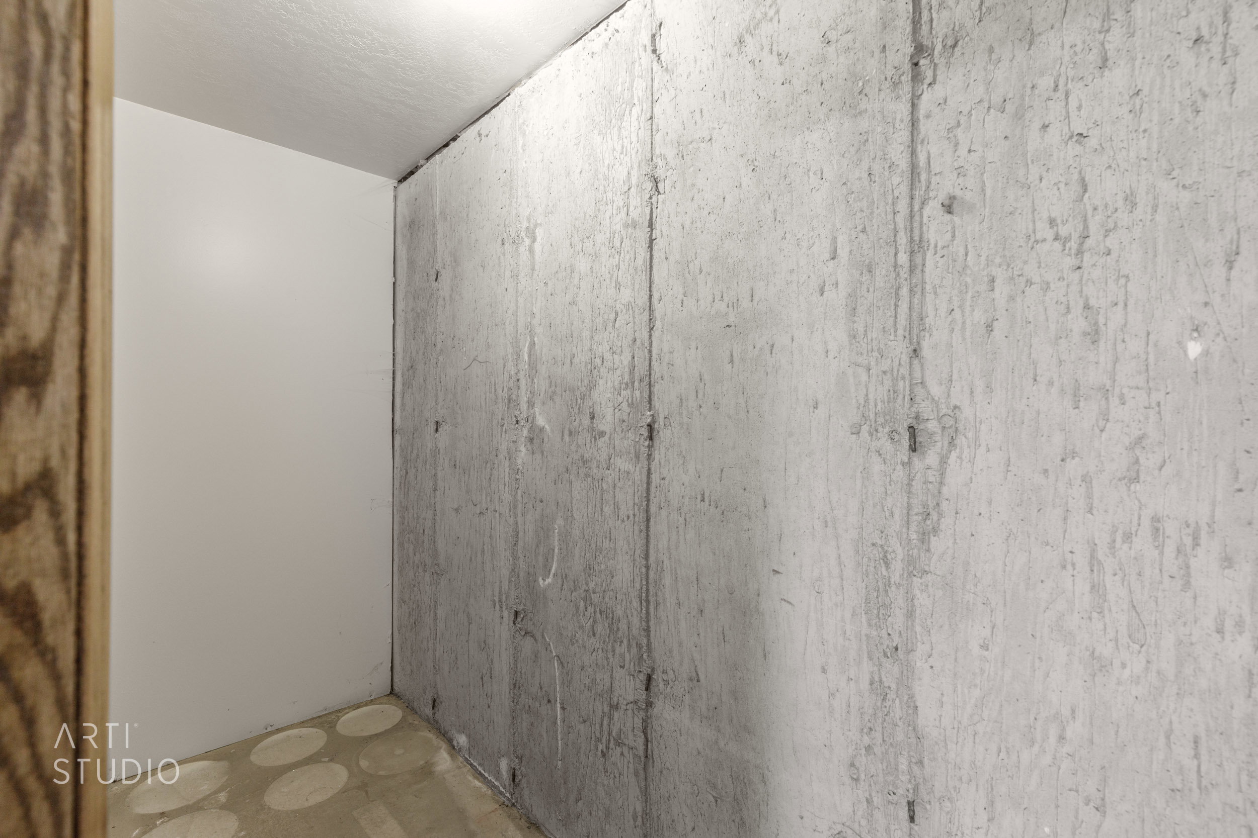 Unfinished concrete wall with a raw, industrial aesthetic