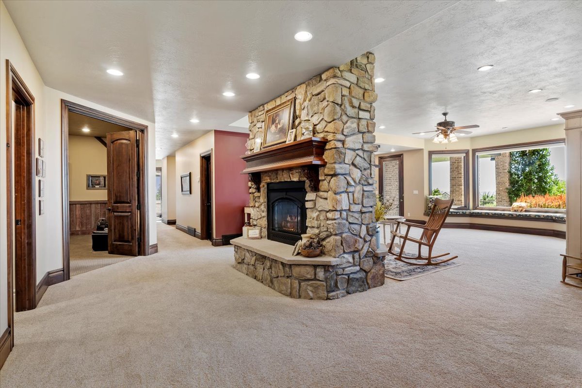 Stone-clad fireplace with a wood mantle