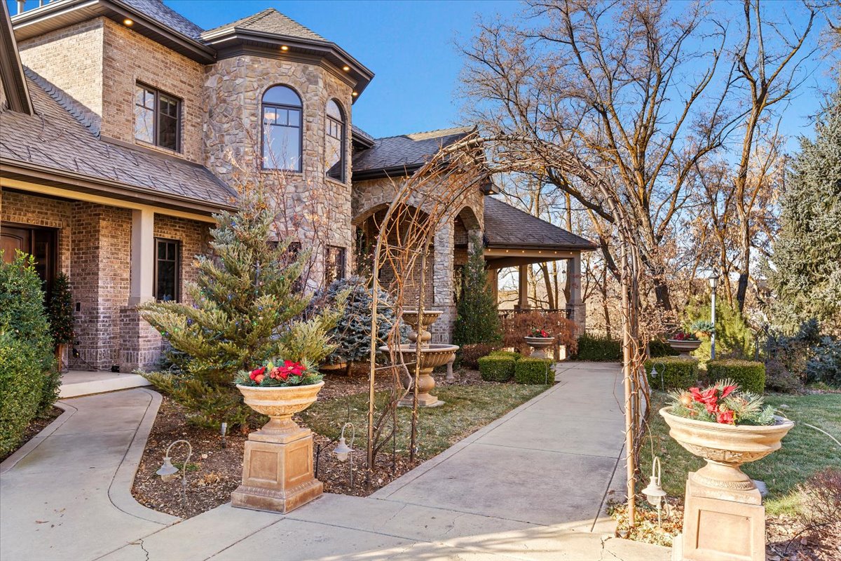 Stately brick and stone exterior with a prominent turret feature