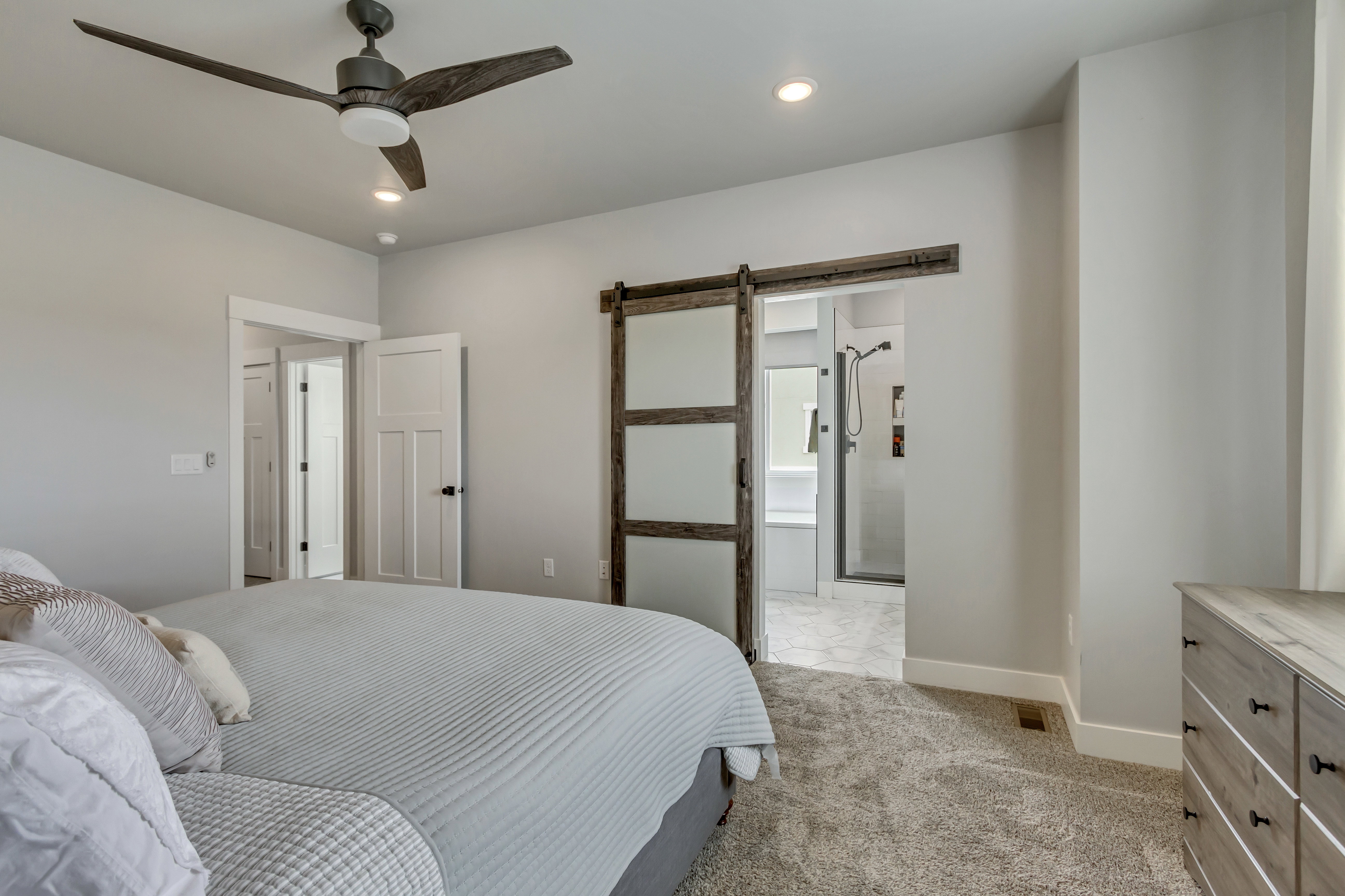 Bedroom featuring a wood-look ceiling fan with integrated lighting, recessed lighting, and soft carpet flooring