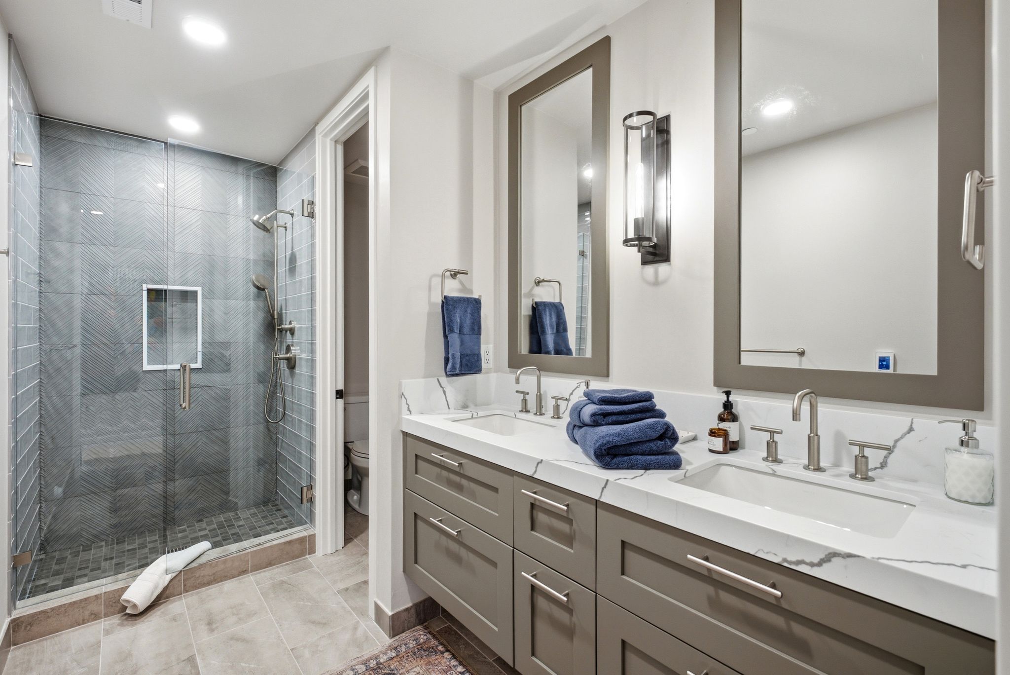 Dual vanity with undermount sinks and extensive countertop space